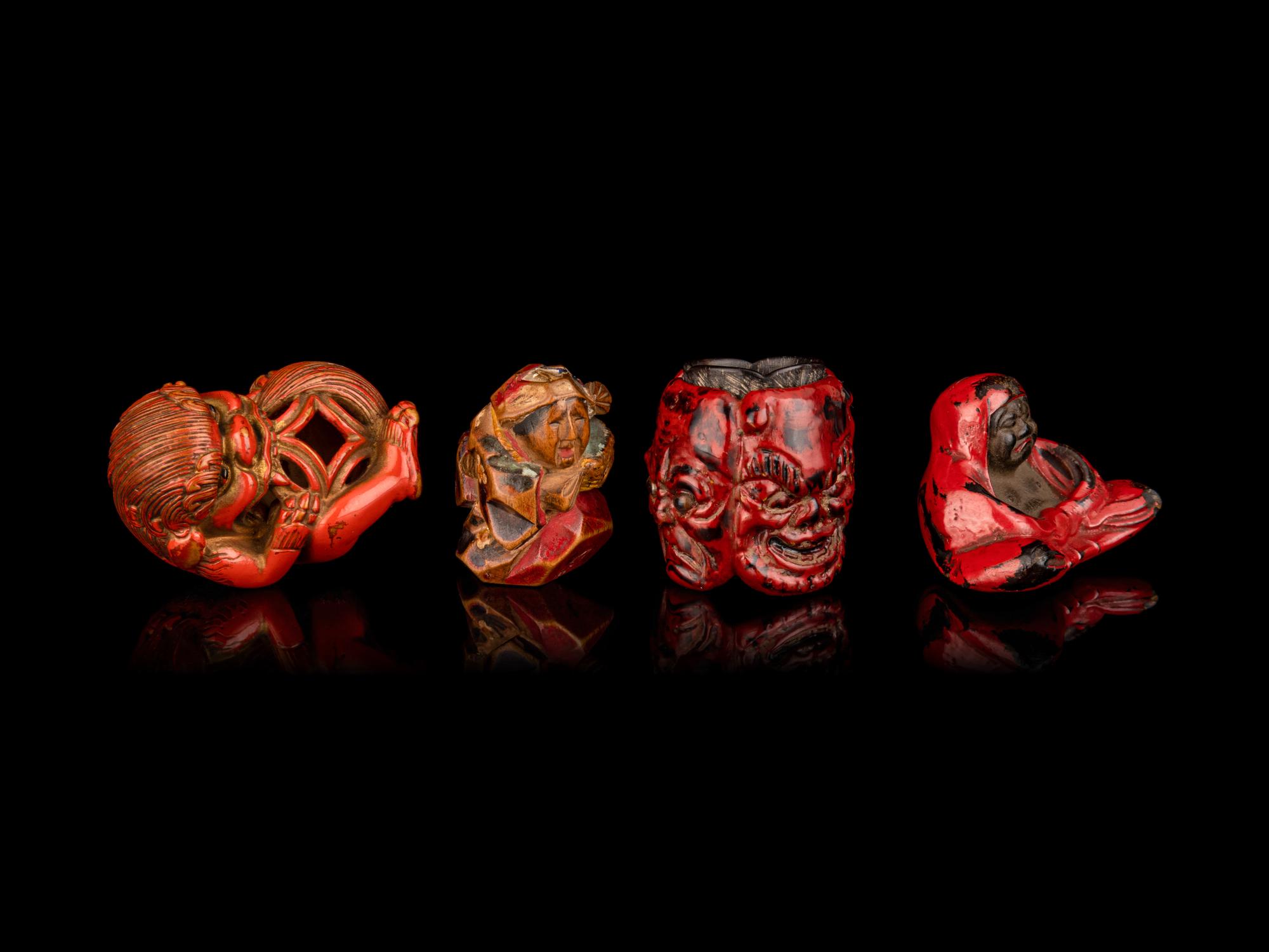 Four Japanese Carved and Red Lacquered Wood Netsuke