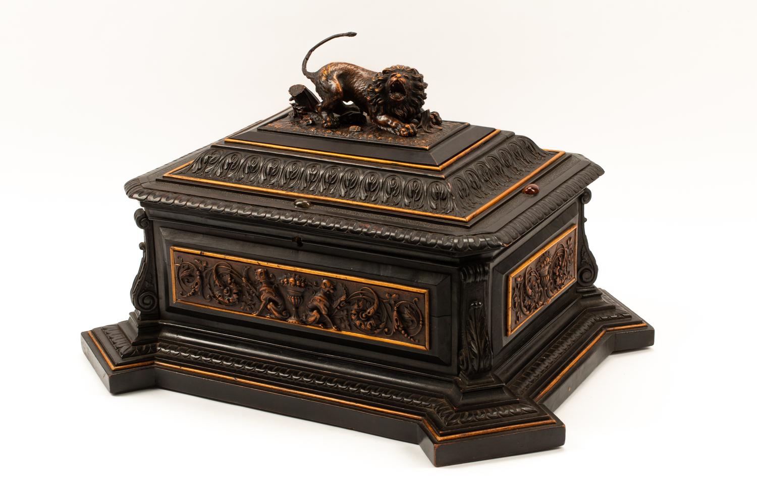 An Austrian Carved and Ebonized Wood Table Casket with a Lion