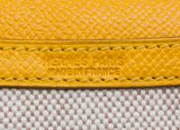 An Hermes Cream Toile and Yellow Leather Rio Clutch, 8.5" x 6" x 1.5".