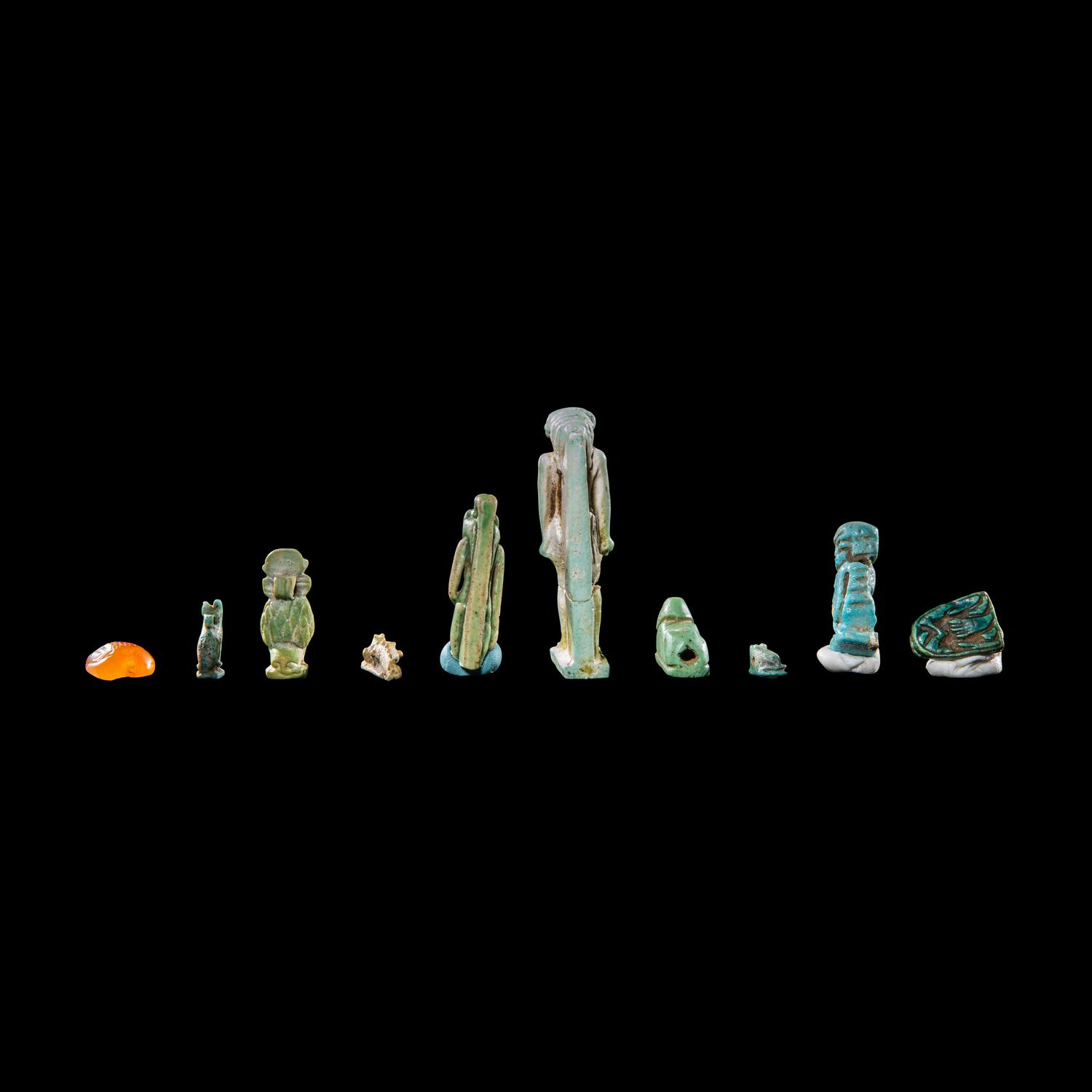 Ten Egyptian Faience and Carnelian Amulets