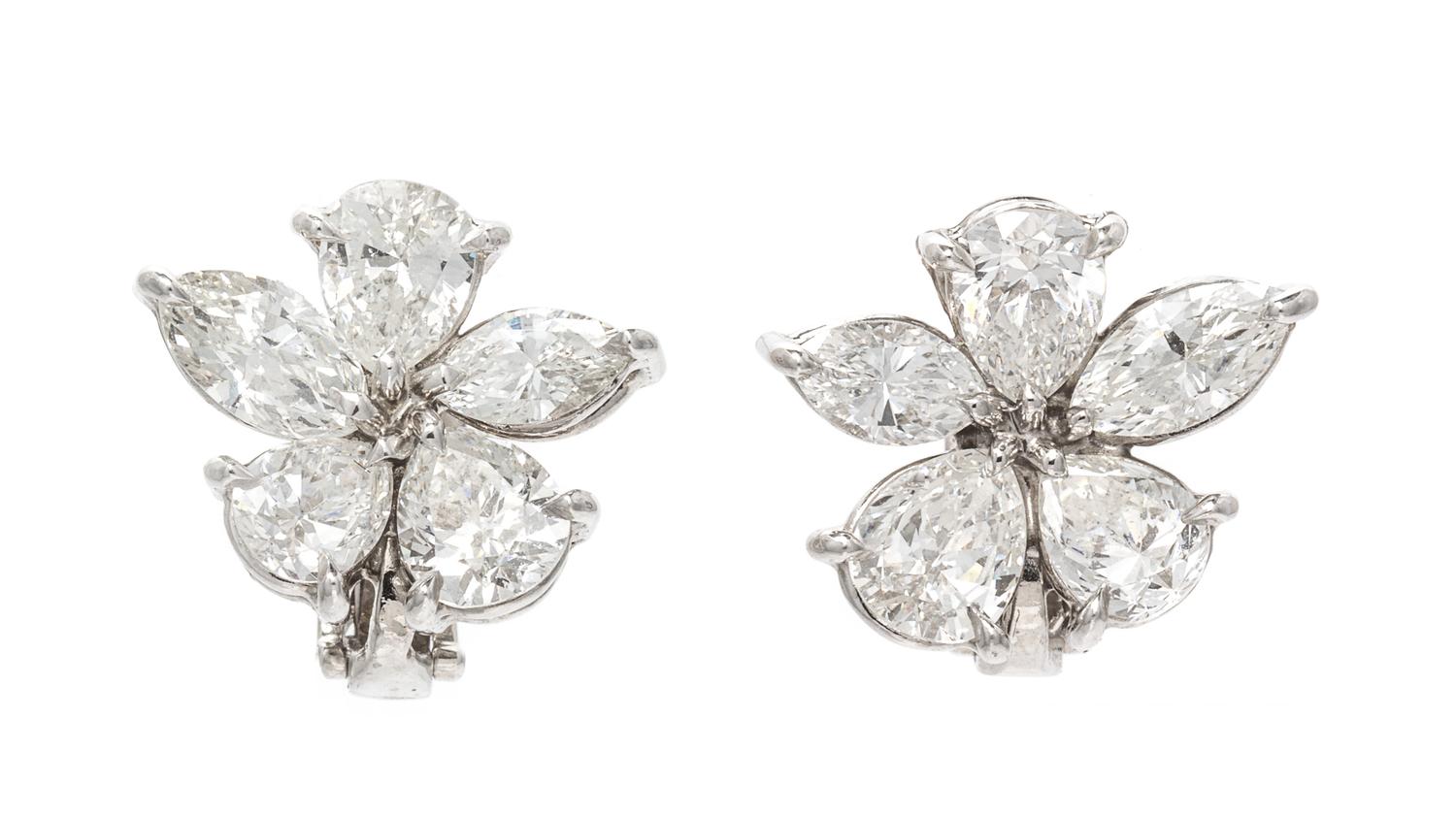 A Pair of Platinum and Diamond Floral Cluster Earclips, 5.10 dwts.