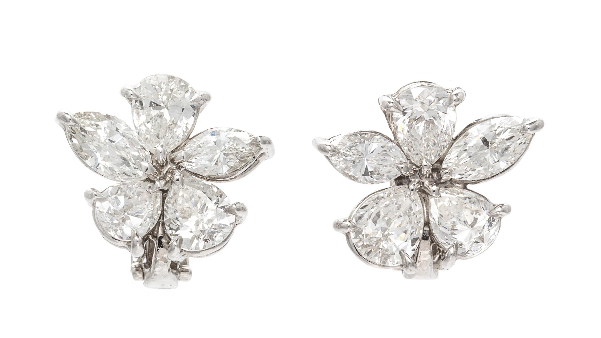 A Pair of Platinum and Diamond Floral Cluster Earclips, 5.10 dwts.