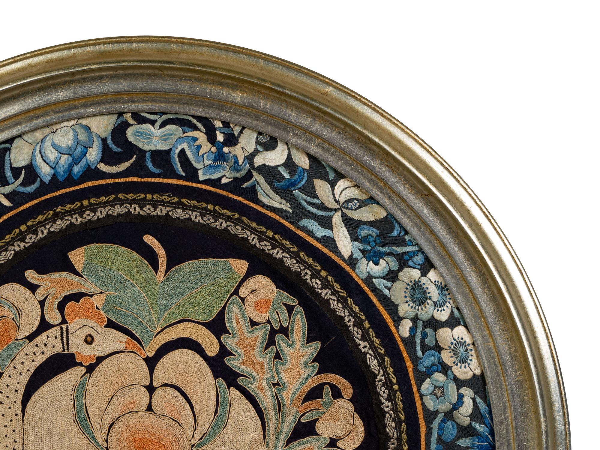 A Chinese Framed Blue Ground Embroidered Silk Panel Diameter 13 1/2 inches.