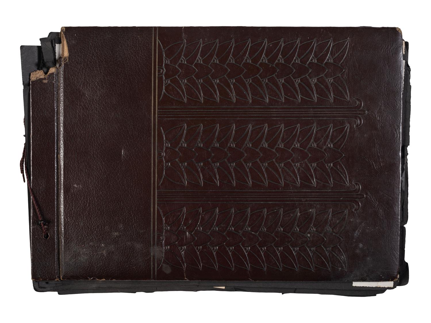 [WORLD WAR II]. Photo album and insignia belonging to an African American soldier.