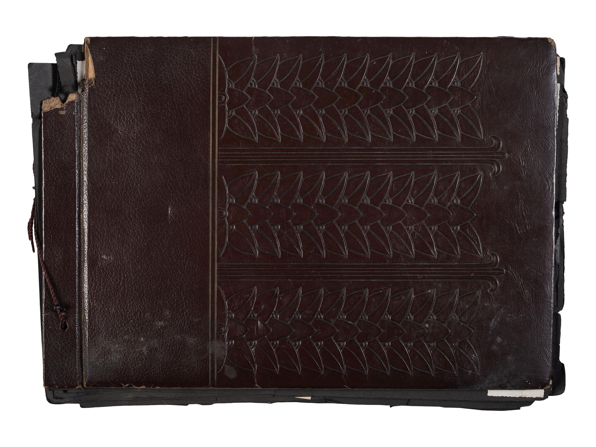 [WORLD WAR II]. Photo album and insignia belonging to an African American soldier.