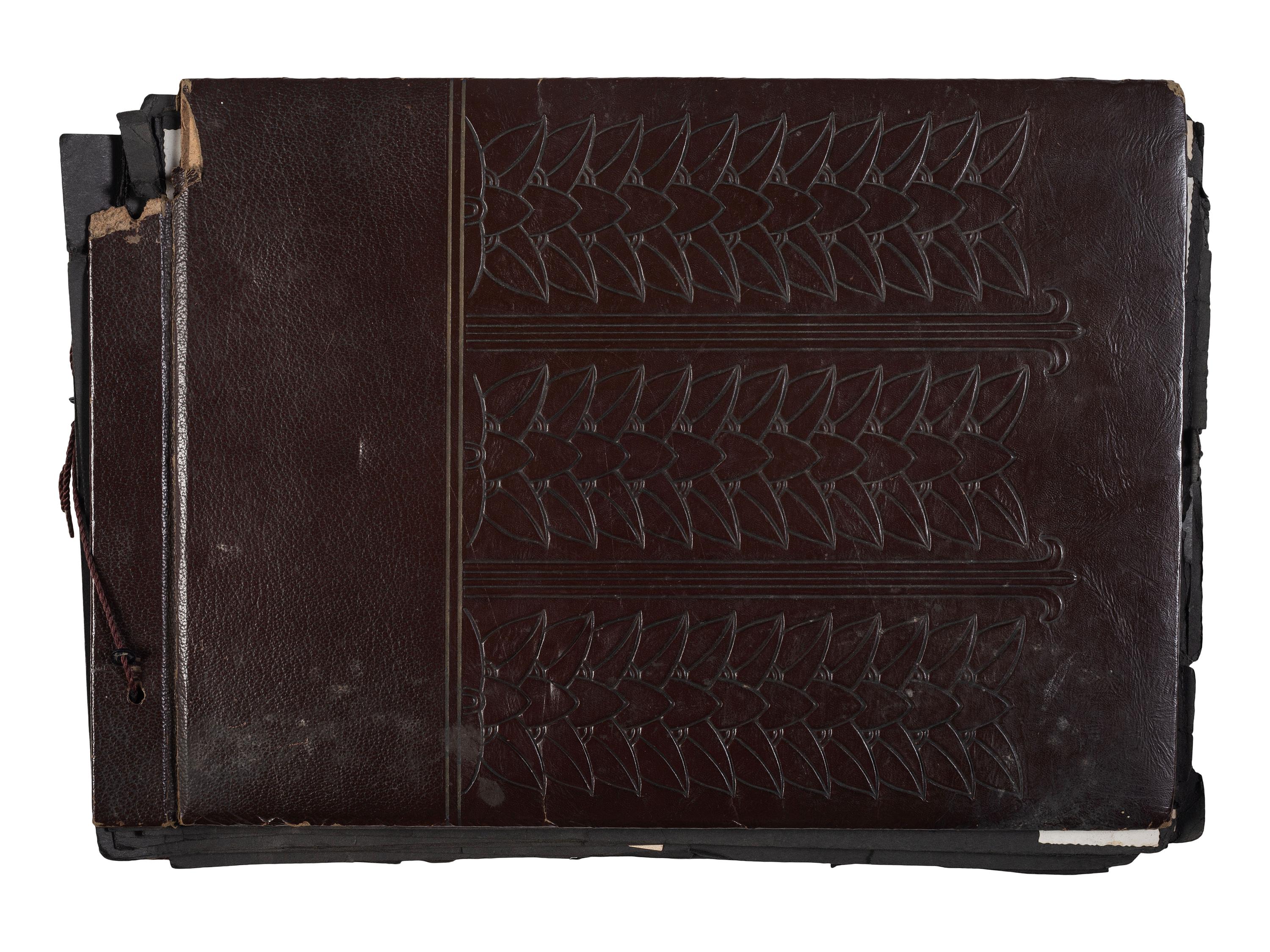[WORLD WAR II]. Photo album and insignia belonging to an African American soldier.