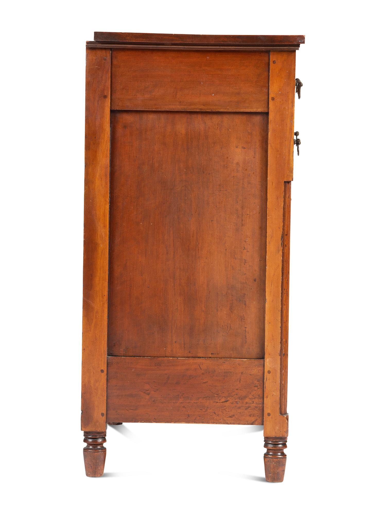 A Federal Carved and Inlaid Cherrywood Chest of Drawers