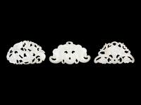 Three Chinese Pale Celadon Jade Reticulated Flori-Form Pendants