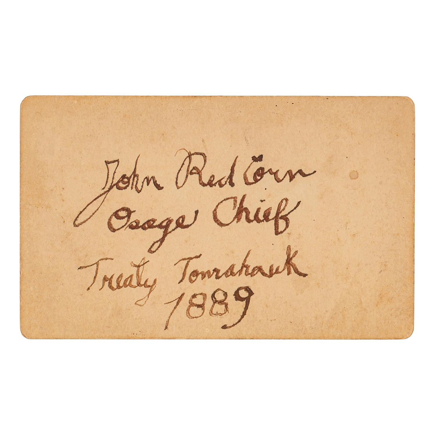 [NATIVE AMERICANS]. CDV of Native American identified as Osage Chief John Red Corn with treaty tomahawk. N.p.: n.p., 1889.