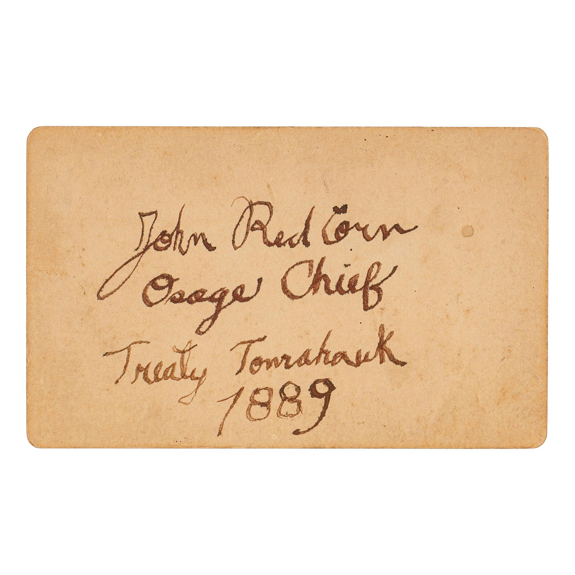 [NATIVE AMERICANS]. CDV of Native American identified as Osage Chief John Red Corn with treaty tomahawk. N.p.: n.p., 1889.