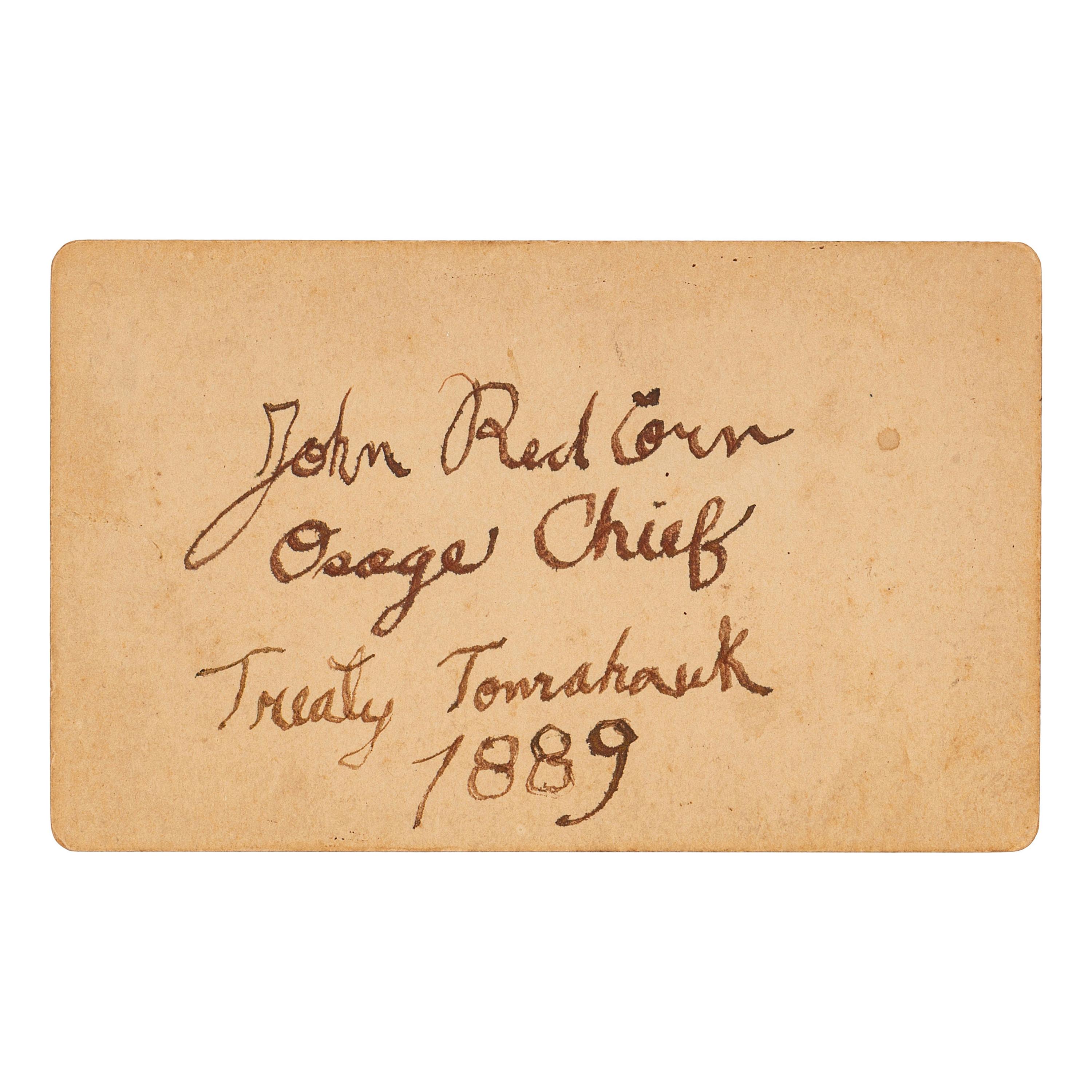 [NATIVE AMERICANS]. CDV of Native American identified as Osage Chief John Red Corn with treaty tomahawk. N.p.: n.p., 1889.