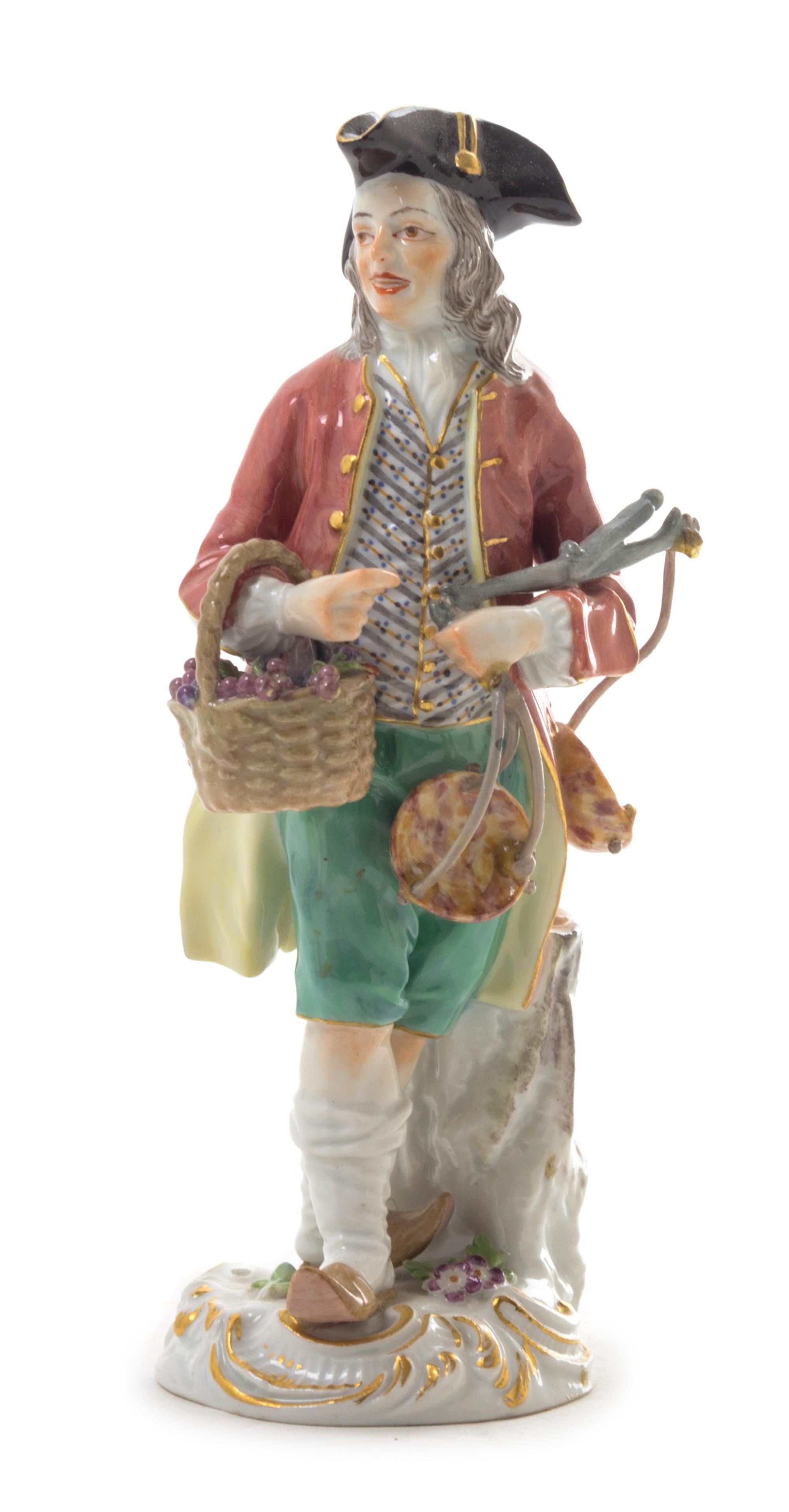 A Meissen Porcelain Figure Height 5 1/2 inches.