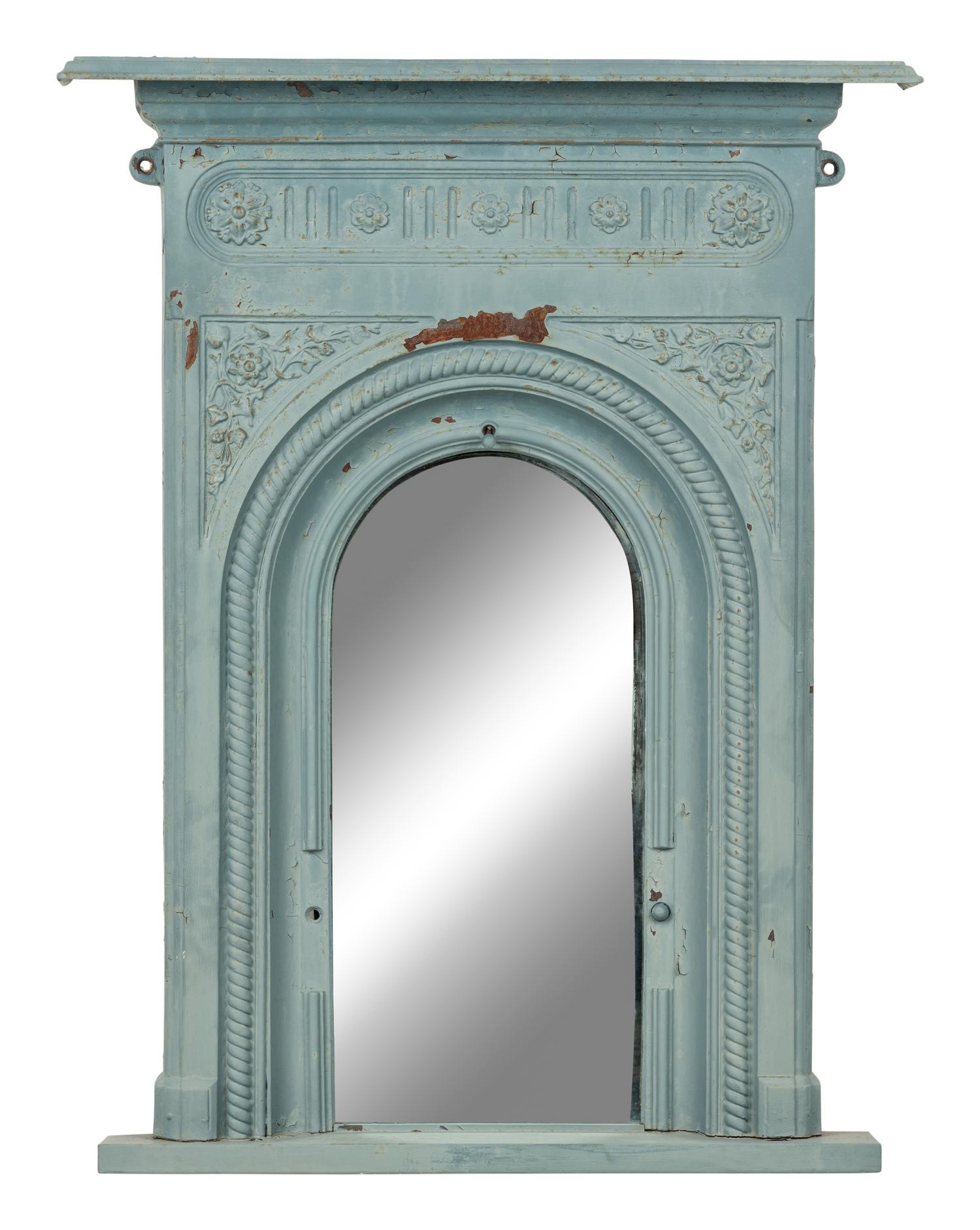 A Patinated Cast Iron Mirror