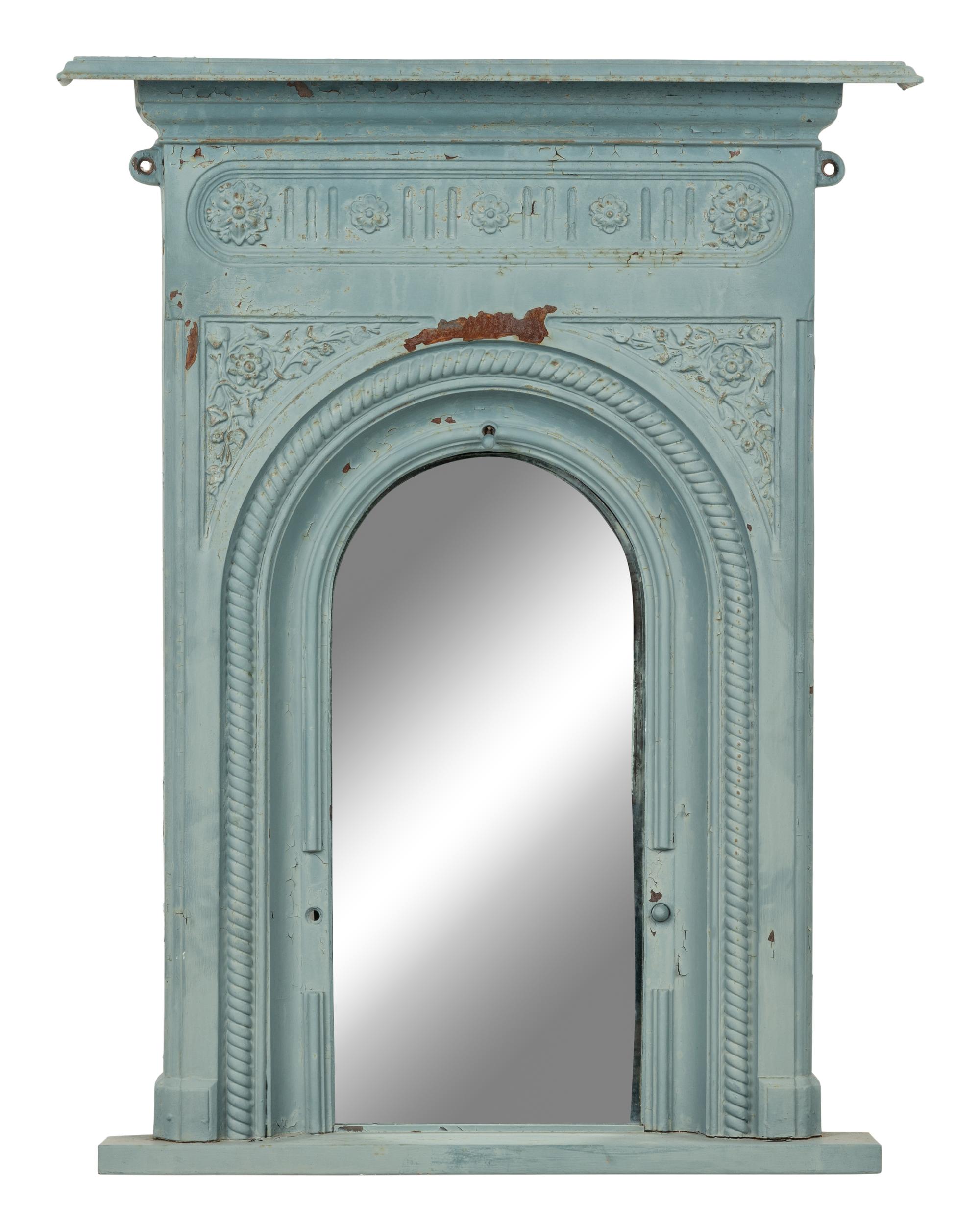 A Patinated Cast Iron Mirror