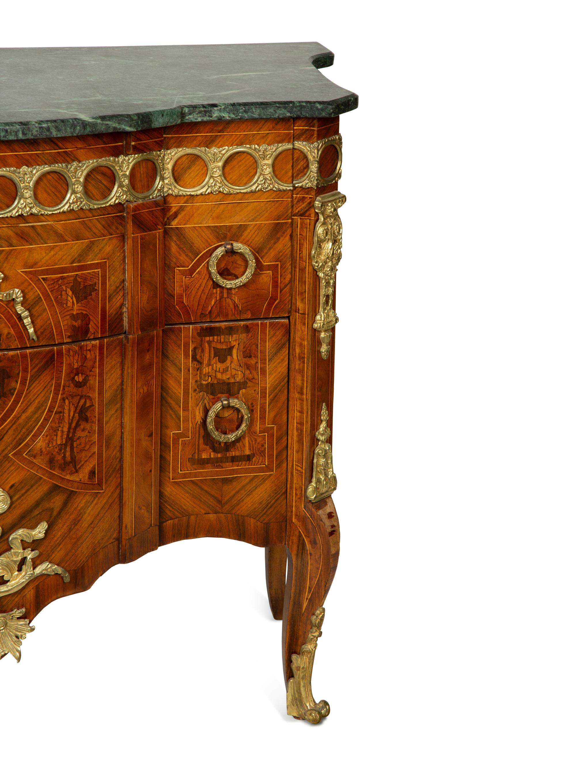 A Louis XVI Style Gilt Bronze Mounted Marquetry Marble-Top Commode