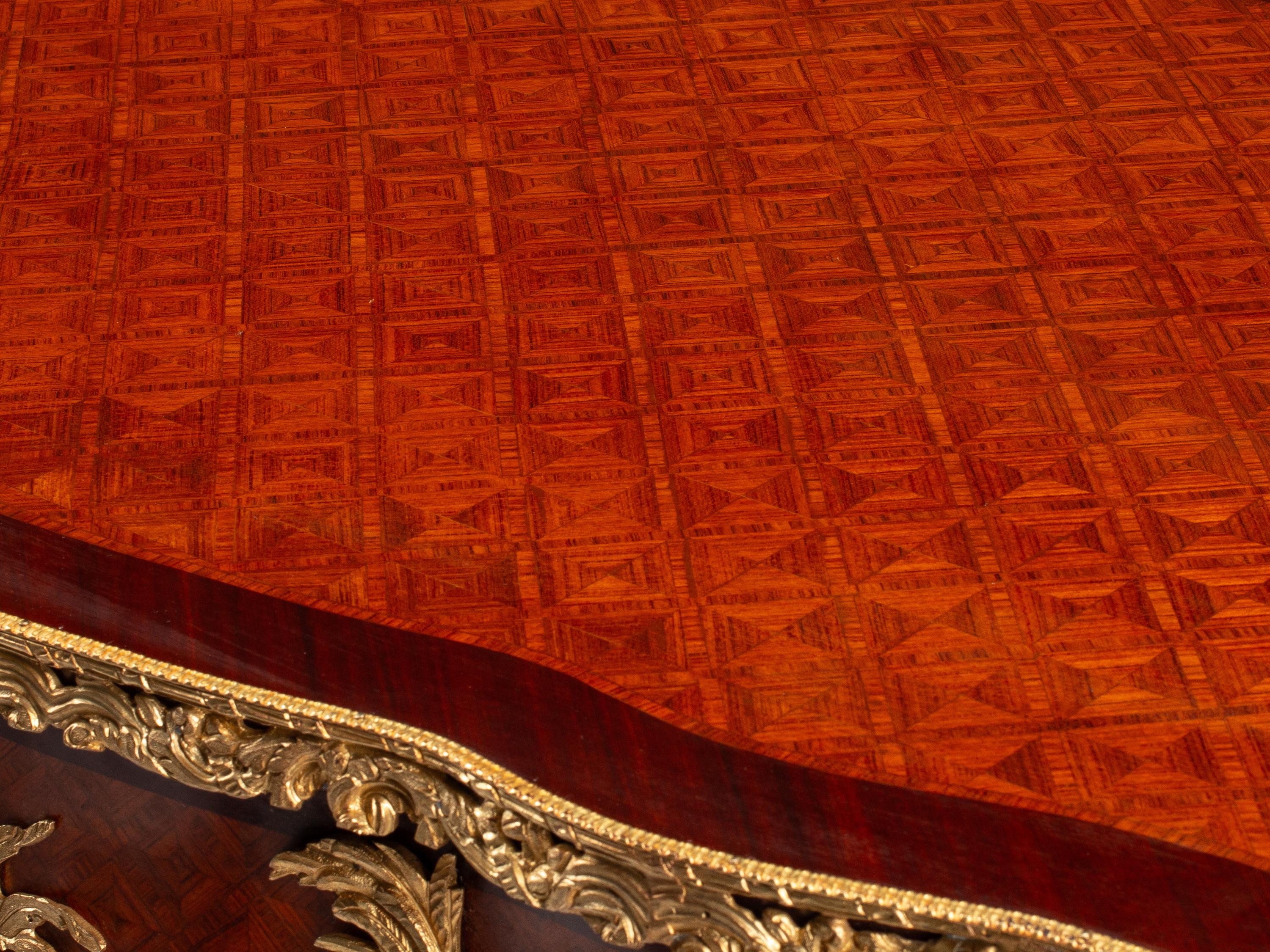 A Louis XV Style Gilt Bronze Mounted Parquetry Bureau Plat