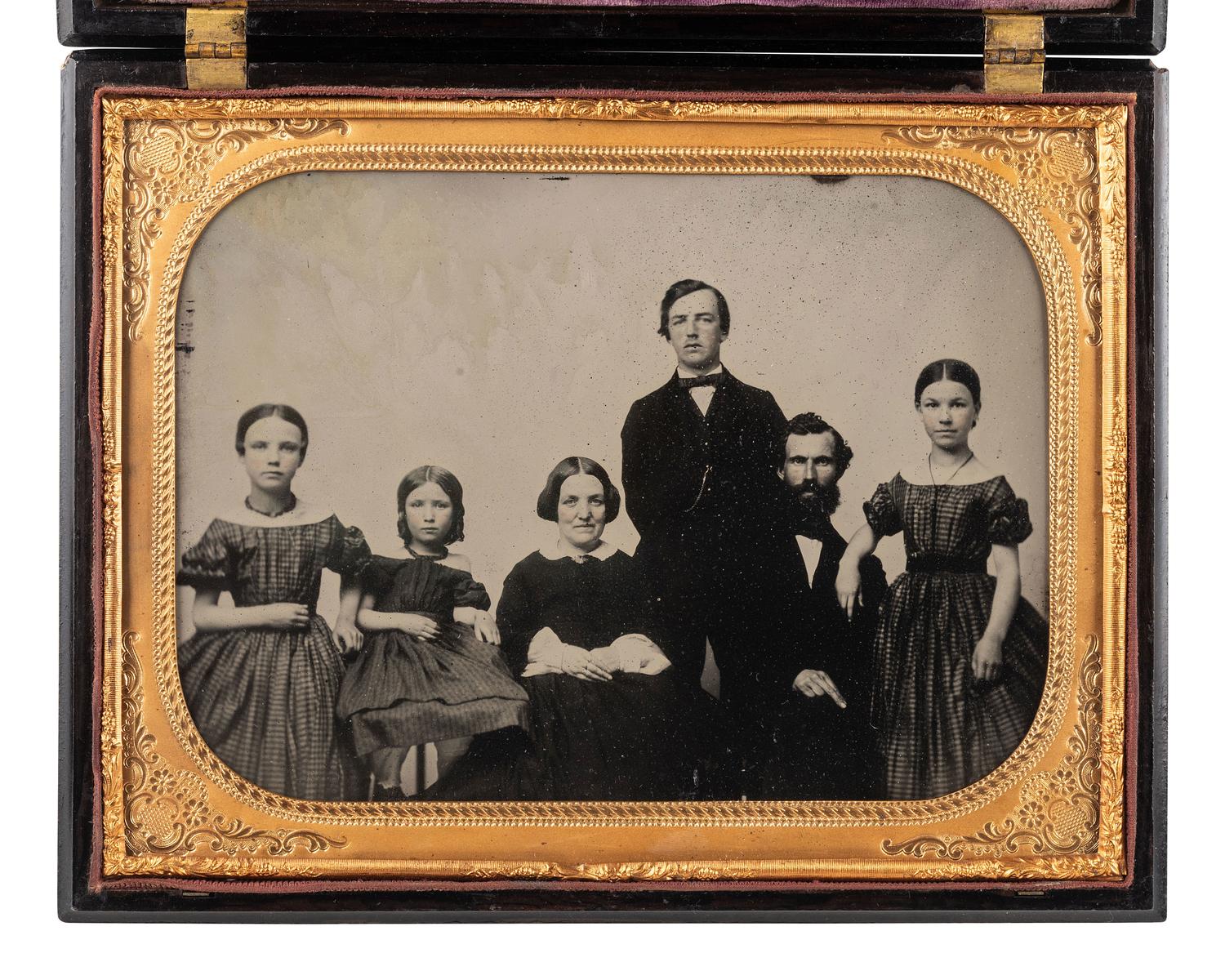 [EARLY PHOTOG.]. Landing of Columbus . Rare whole plate Union case containing ambrotype of a family.