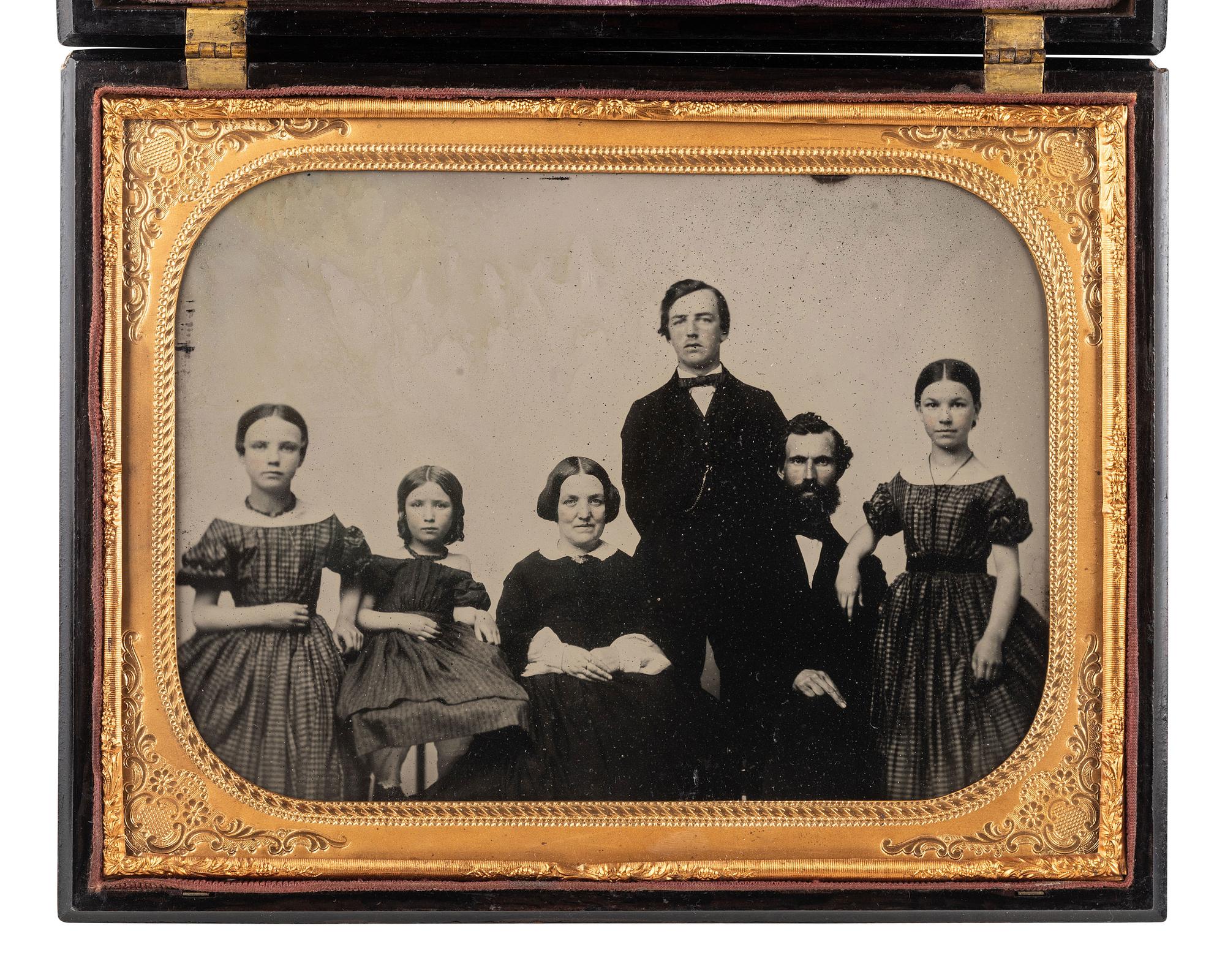[EARLY PHOTOG.]. Landing of Columbus . Rare whole plate Union case containing ambrotype of a family.