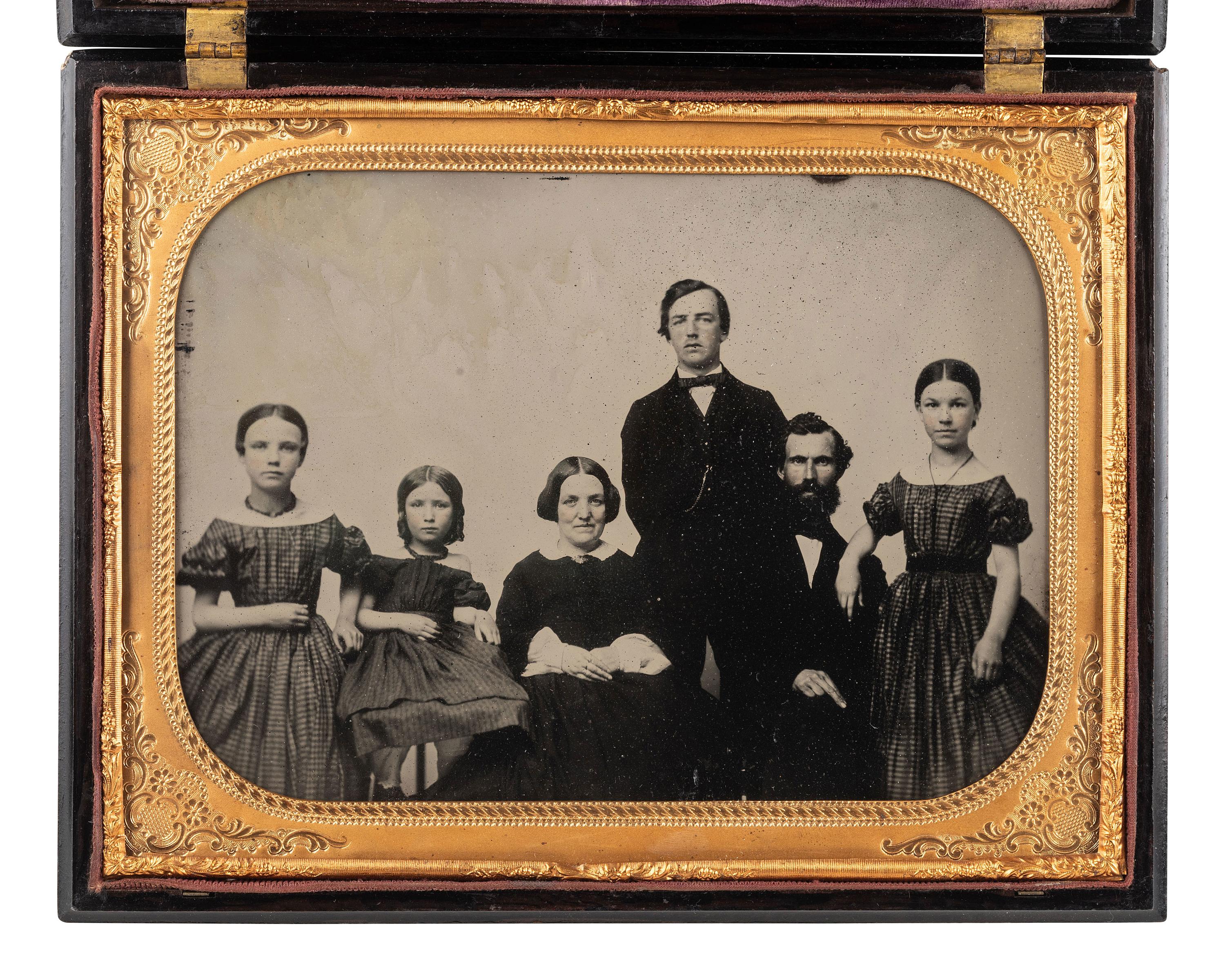[EARLY PHOTOG.]. Landing of Columbus . Rare whole plate Union case containing ambrotype of a family.