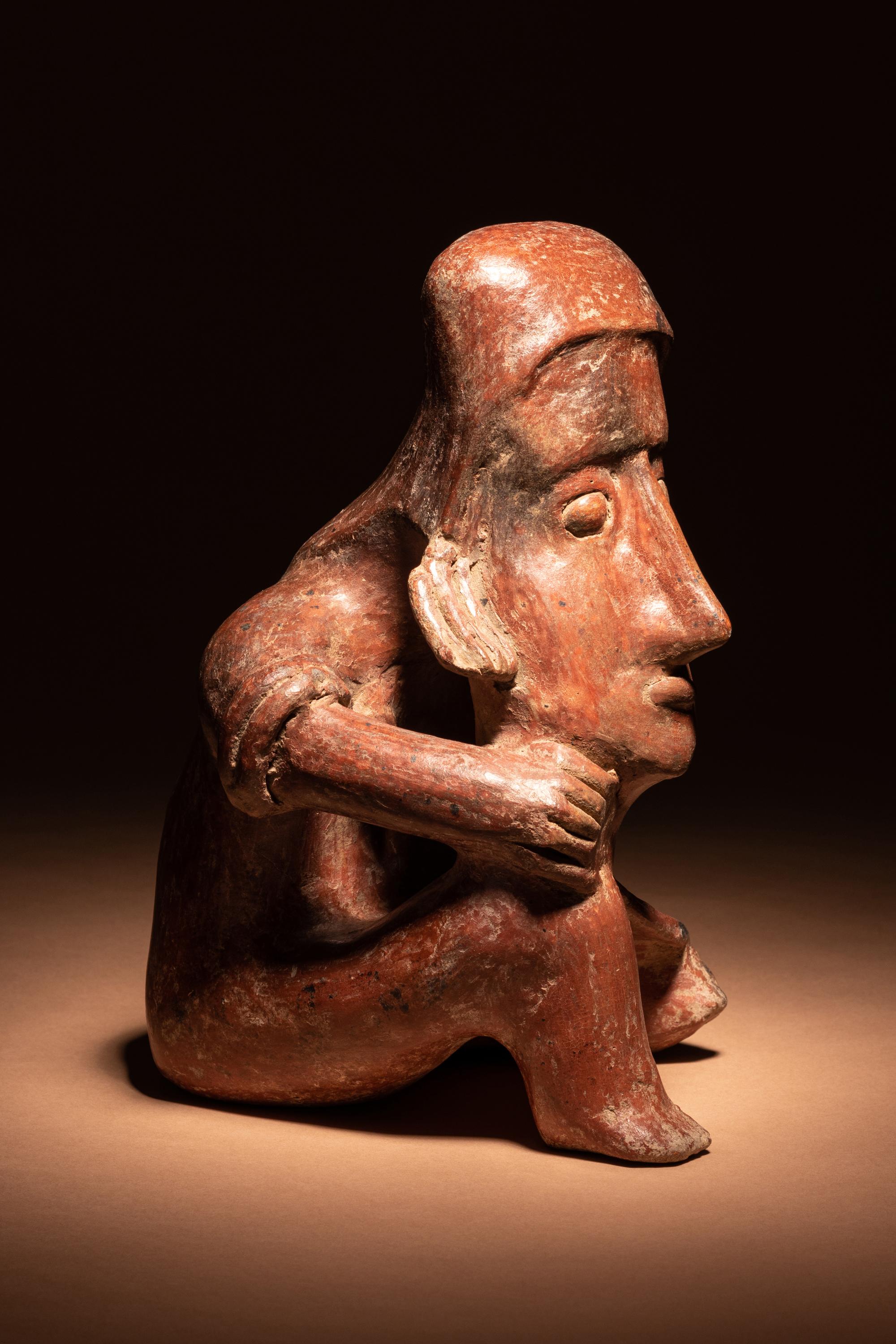 A Colima Terracotta Seated Male Figure