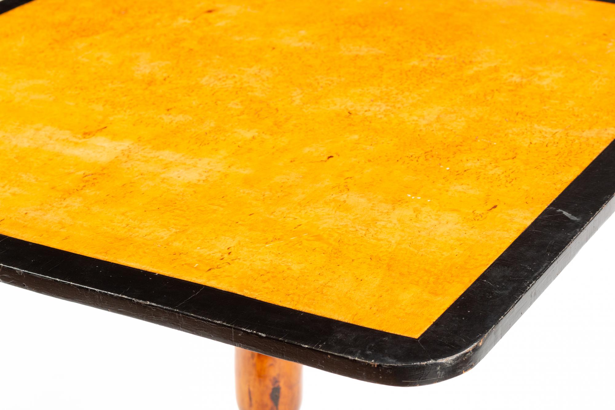A Swedish Parcel Ebonized Birch Tilt-Top Table