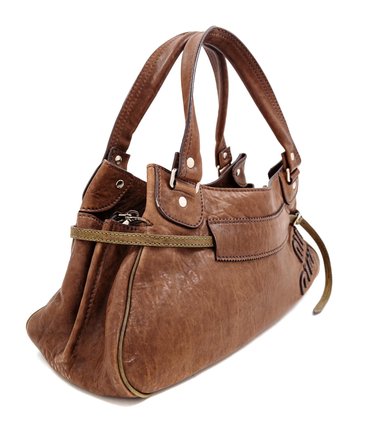 A Miu Miu Brown Leather Handbag, 7" H x 14.75" W x 6" D; Handle drop: 6.5".