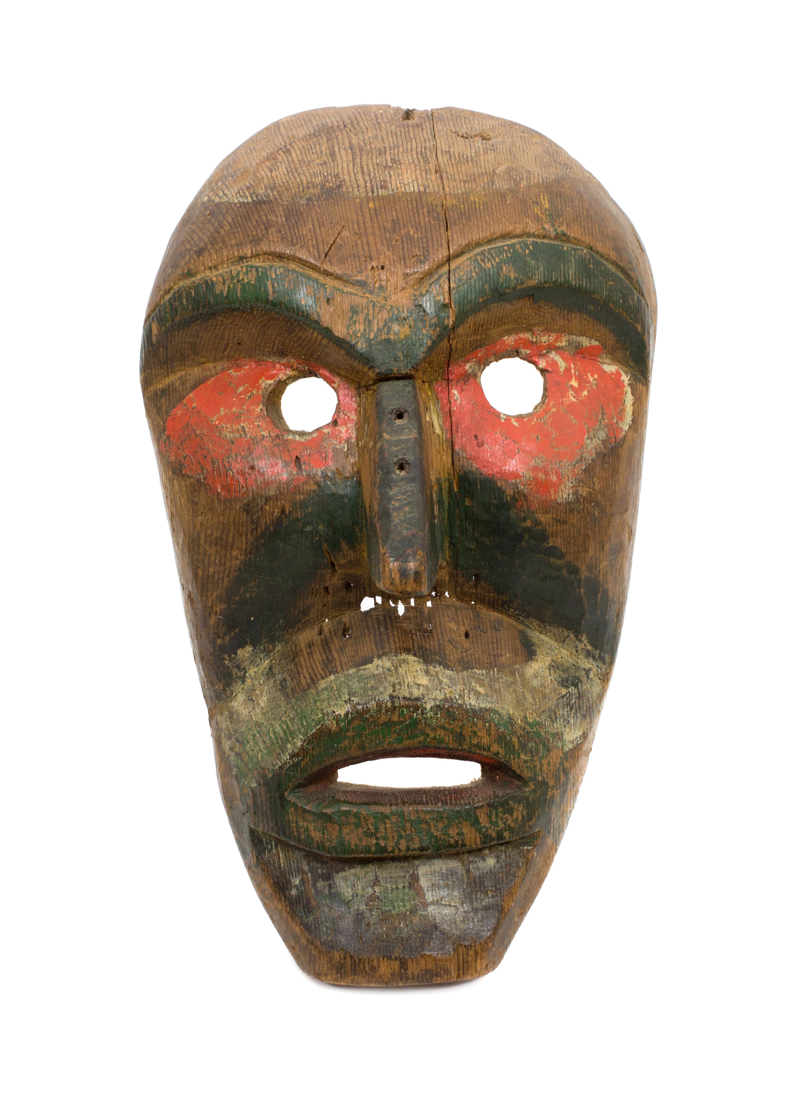 A Kwakwaka'wakw Painted Carved Wood Mask Height 4 1/2 x length 11 1/5 x width 7 inches. — EARLY 20TH CENTURY