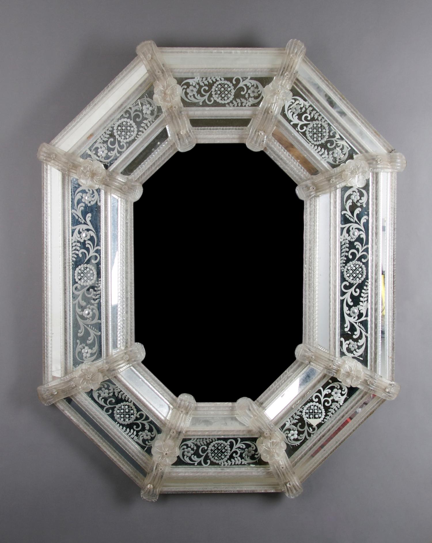 A Venetian Glass Mirror, Height 33 x width 28 inches.