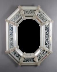 A Venetian Glass Mirror, Height 33 x width 28 inches.