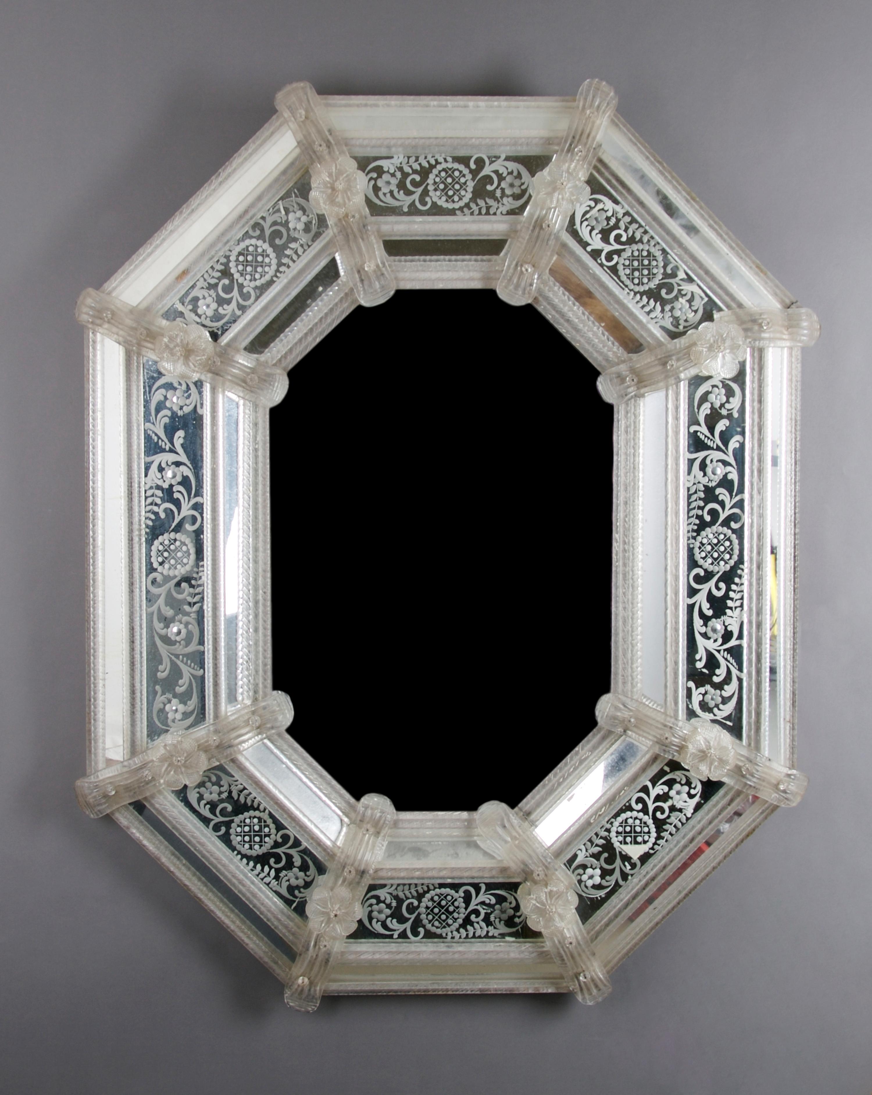 A Venetian Glass Mirror, Height 33 x width 28 inches.