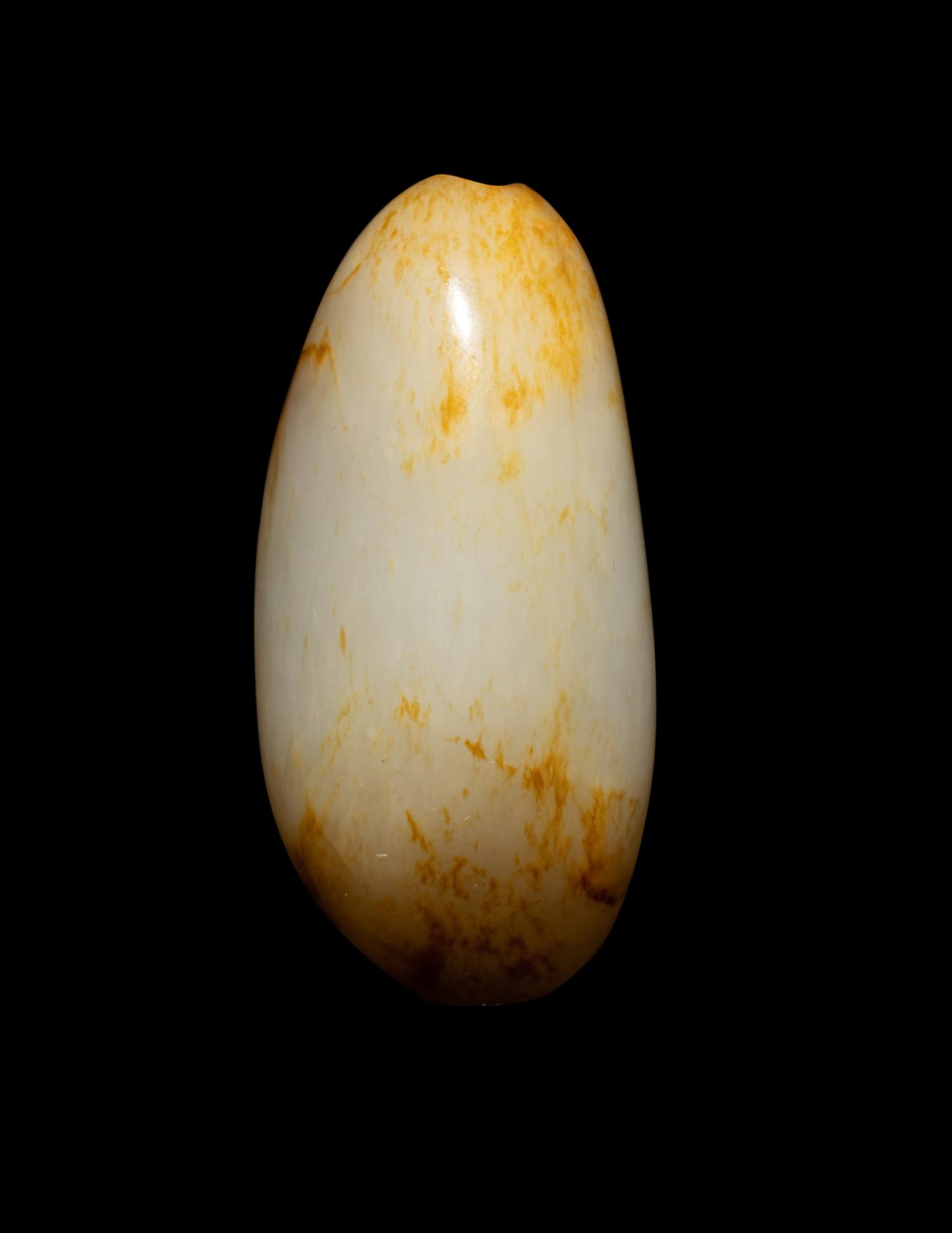 A Chinese Russet and White Jade Pebble-Form Snuff Bottle