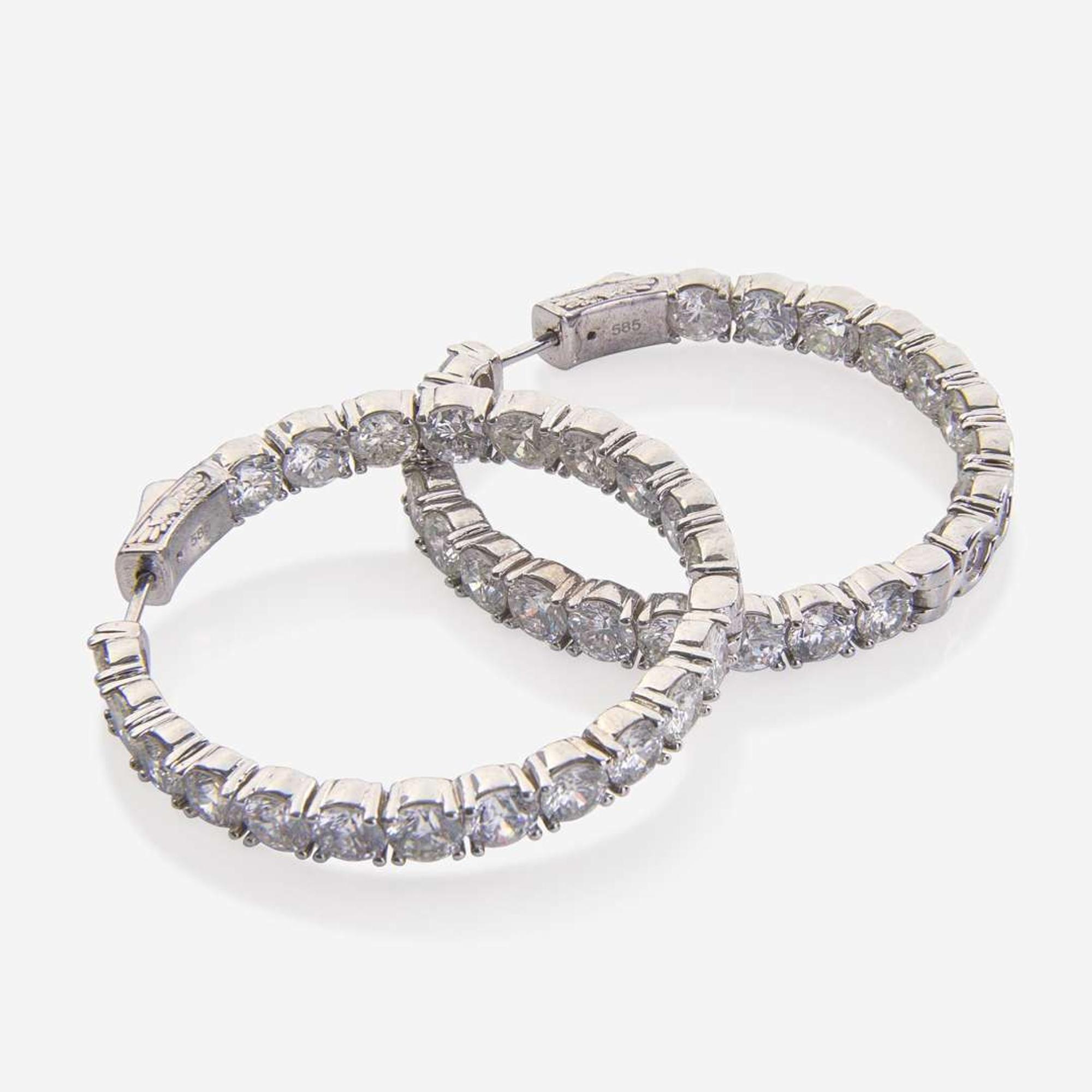 A Pair of 14K White Gold and Diamond Hoop Earrings