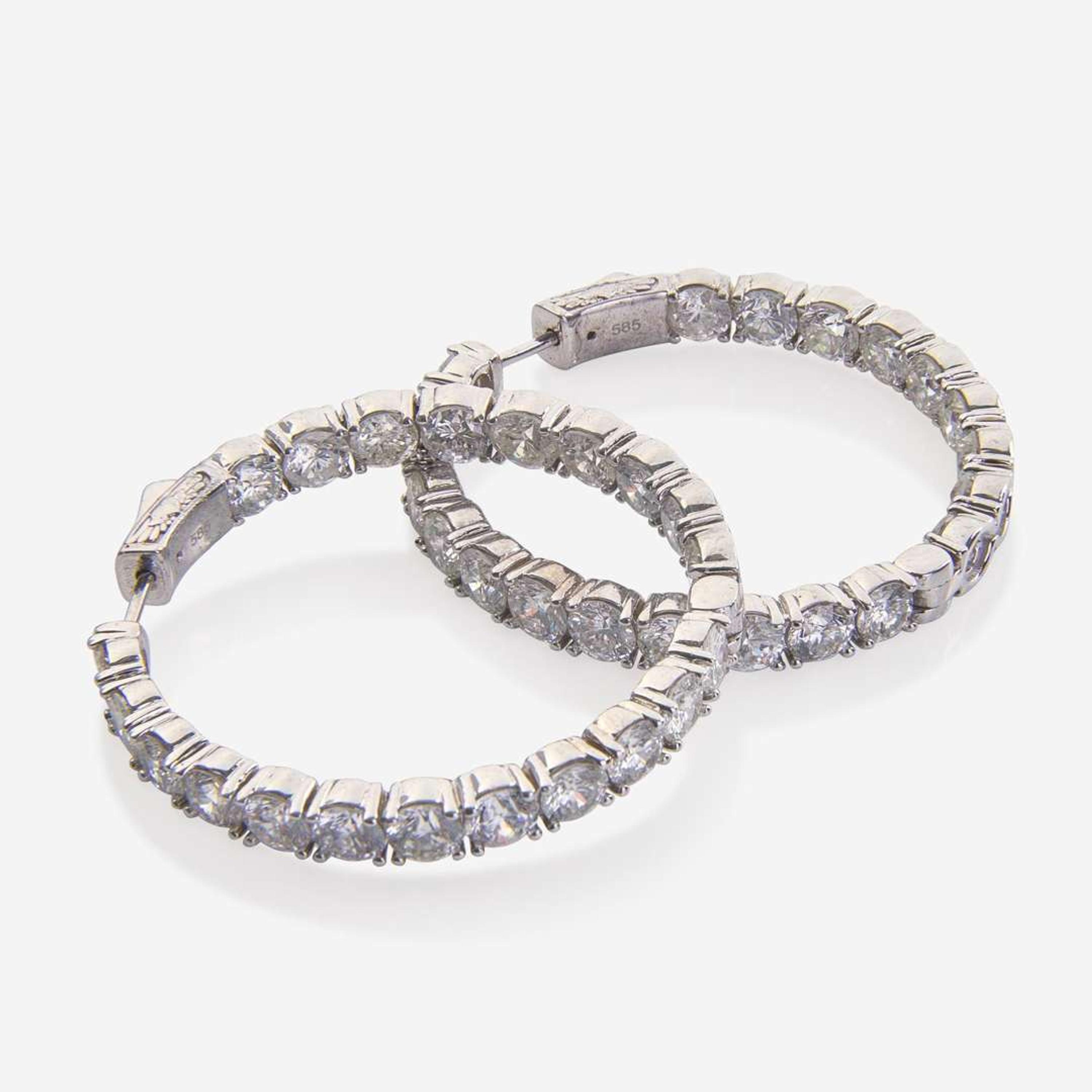 A Pair of 14K White Gold and Diamond Hoop Earrings