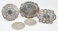 Three American Silver-plate Trivets, , each of extendable form with foliate decoration; together with two American silver mounted trive