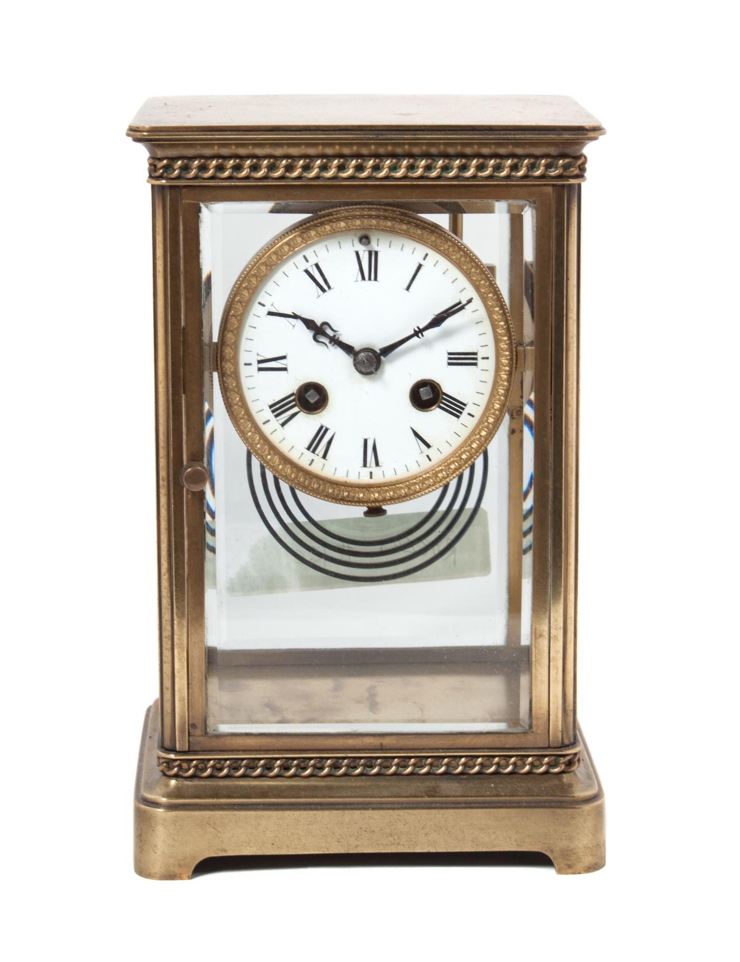 A French Gilt Bronze Regulator Clock Height 9 inches.