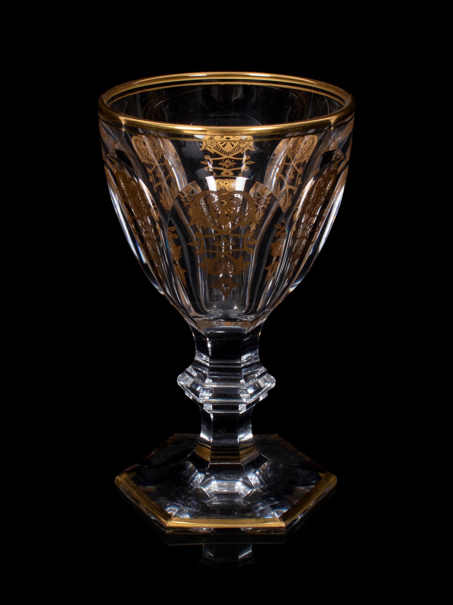 A Baccarat Empire Gilt Decorated Stemware Service