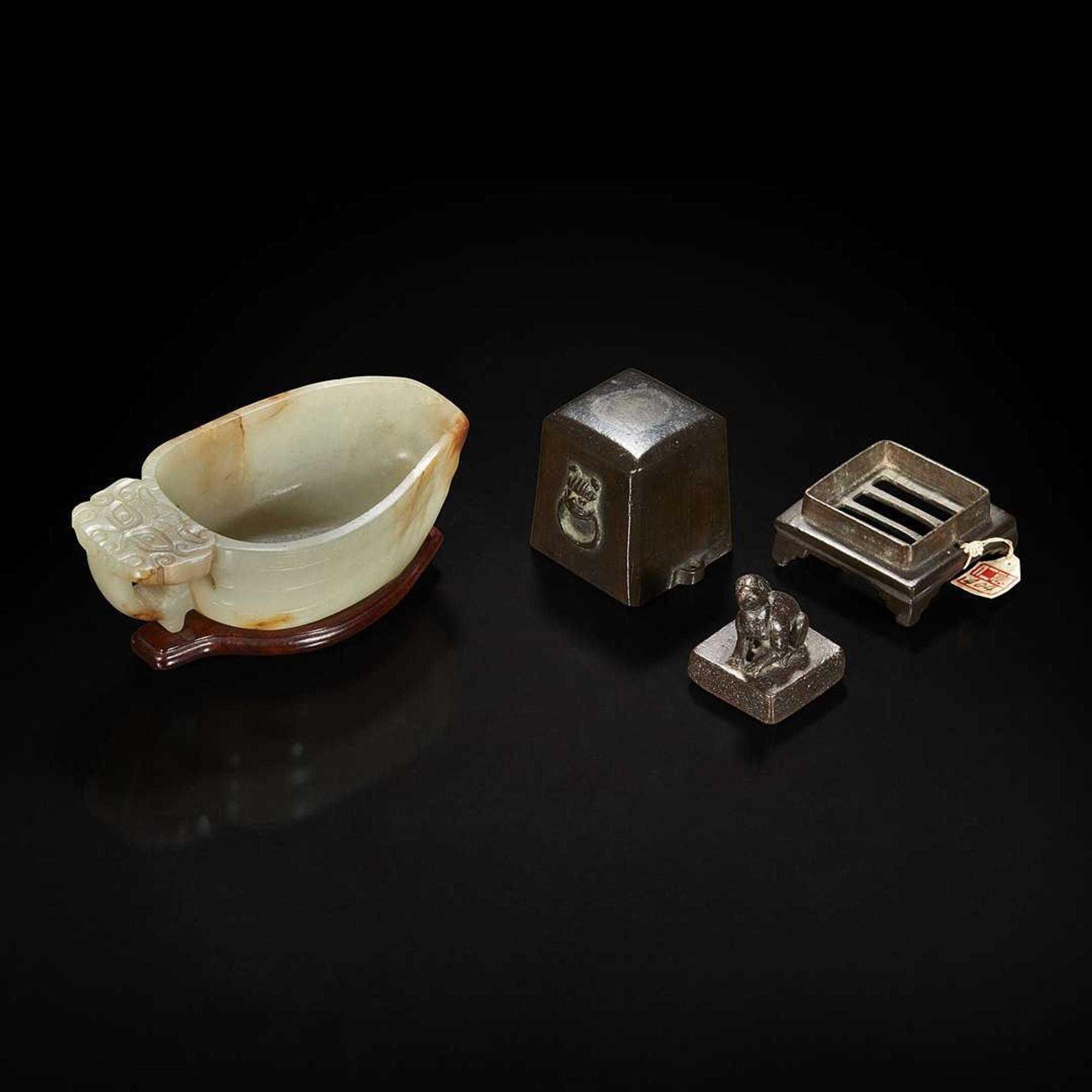 A Chinese pale celadon jade archaistic libation cup and a bronze rabbit seal 玉匜与铜兔印章一组 The jade 17th/18th Century, the seal possibly Yuan dynasty ?????????? ??????