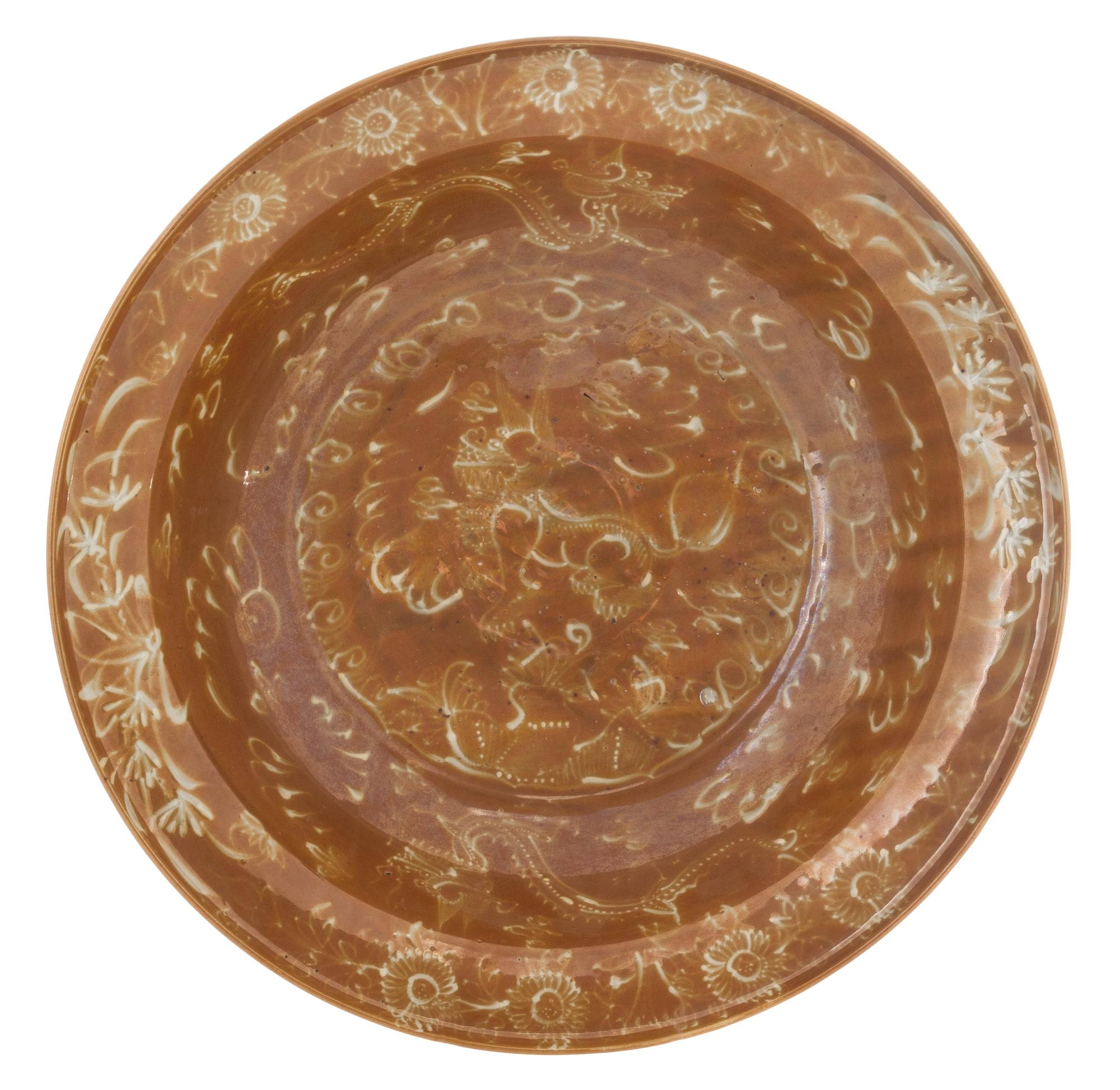 A Large Swatow Slip Decorated Brown Glazed Porcelain Charger Diameter 16 inches. — MING DYNASTY, SECOND HALF OF 16TH CENTURY