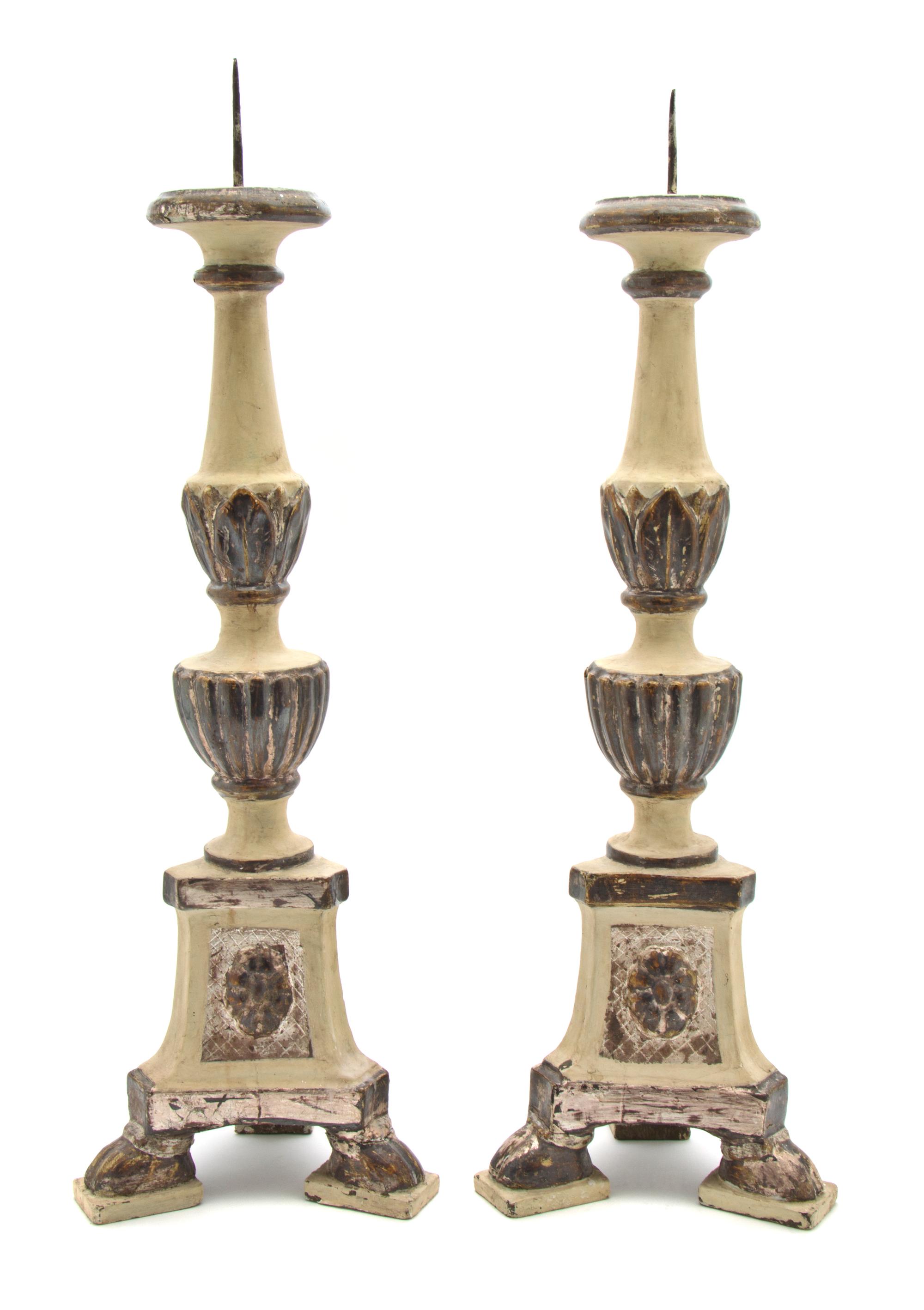 A Pair of Italian Carved, Painted and Silvered Wood Pricket Sticks, Height overall 23 1/4 inches.