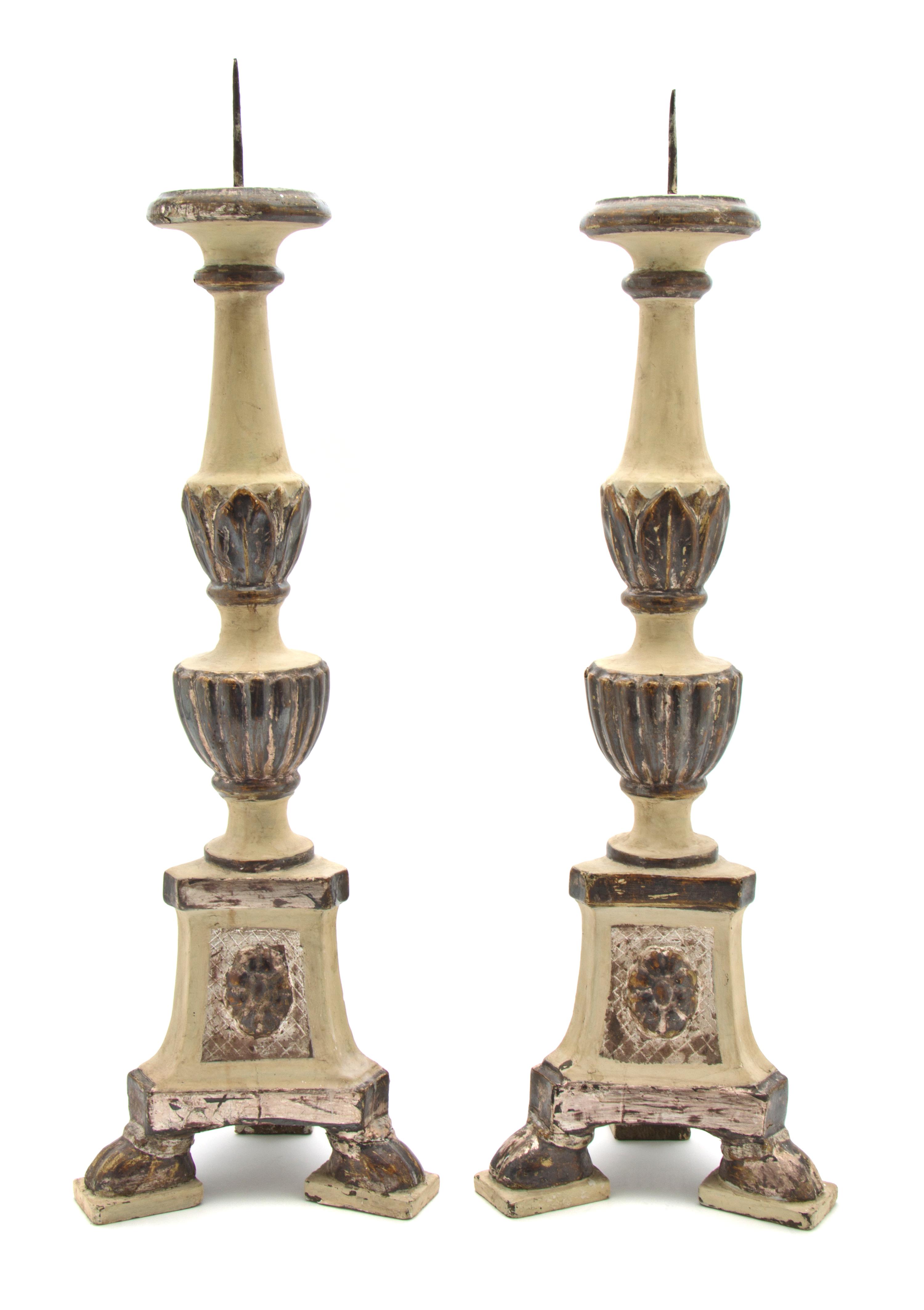 A Pair of Italian Carved, Painted and Silvered Wood Pricket Sticks, Height overall 23 1/4 inches.