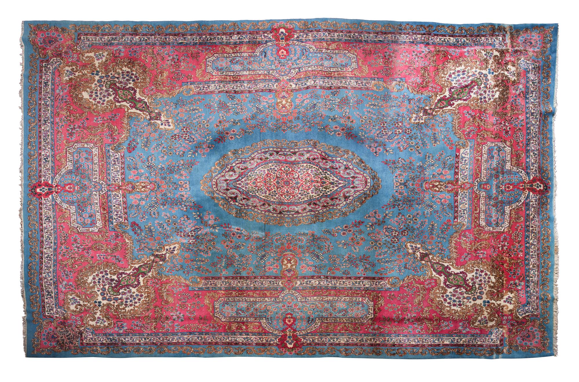 A Tabriz Wool Carpet 16 feet 10 inches x 12 feet 8 inches.