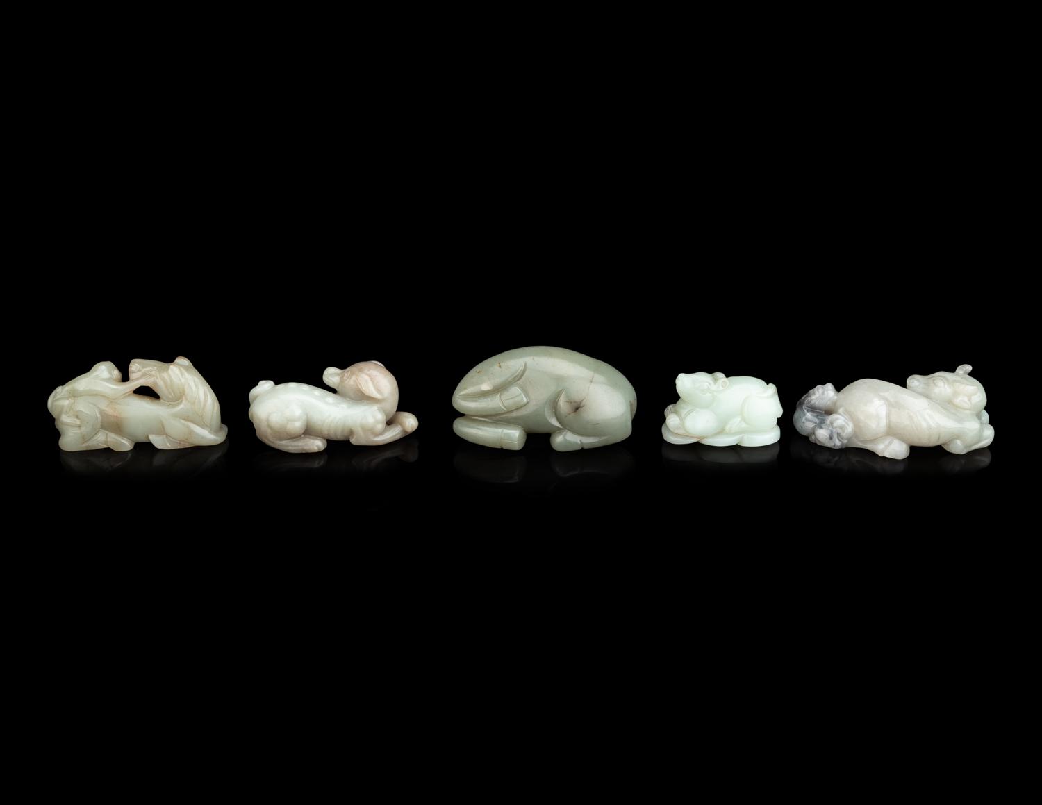 Five Chinese Carved Celadon Jade Figures of Recumbent Animals