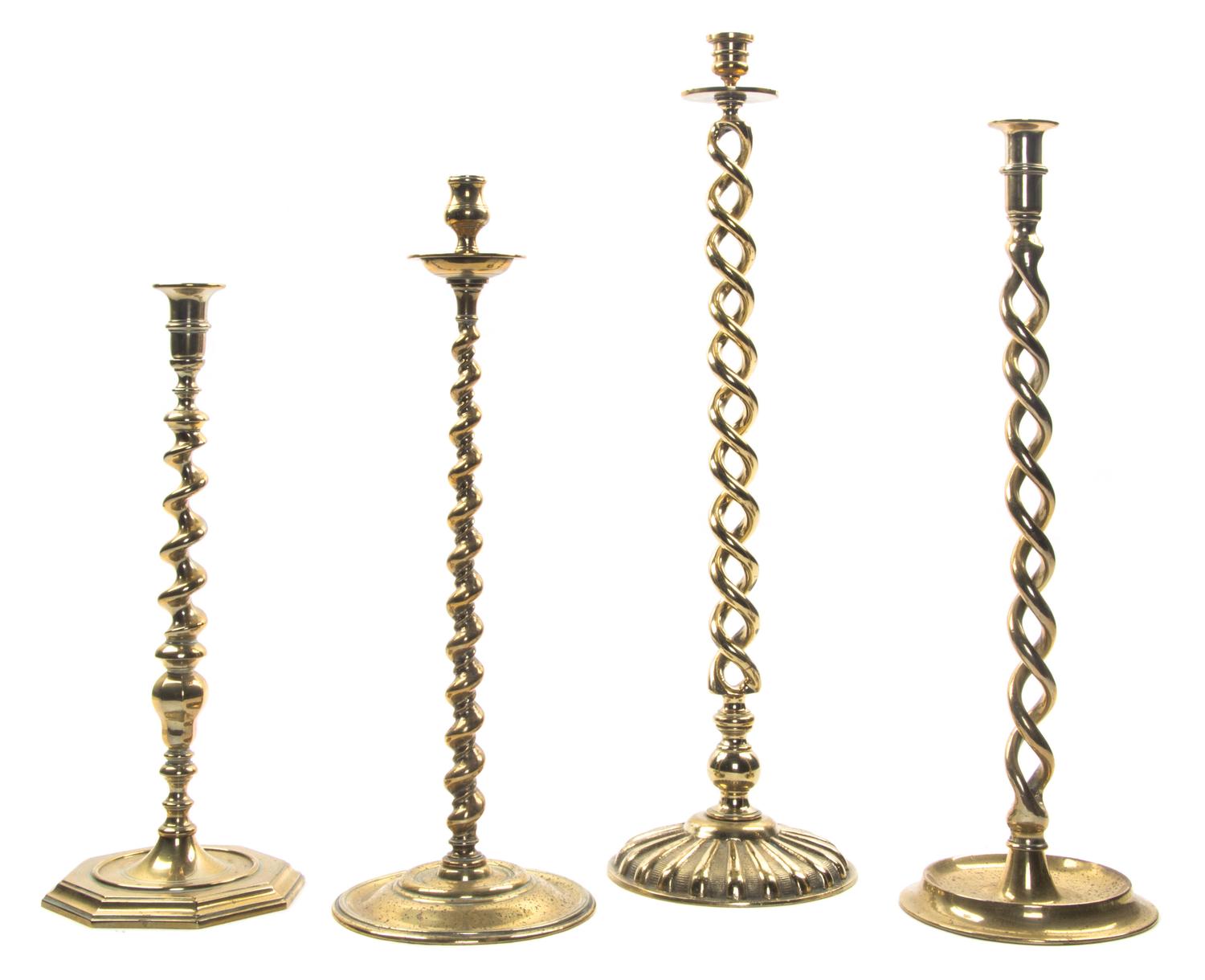 Four English Brass Barley Twist Candlesticks, Height of tallest 22 1/2 inches.