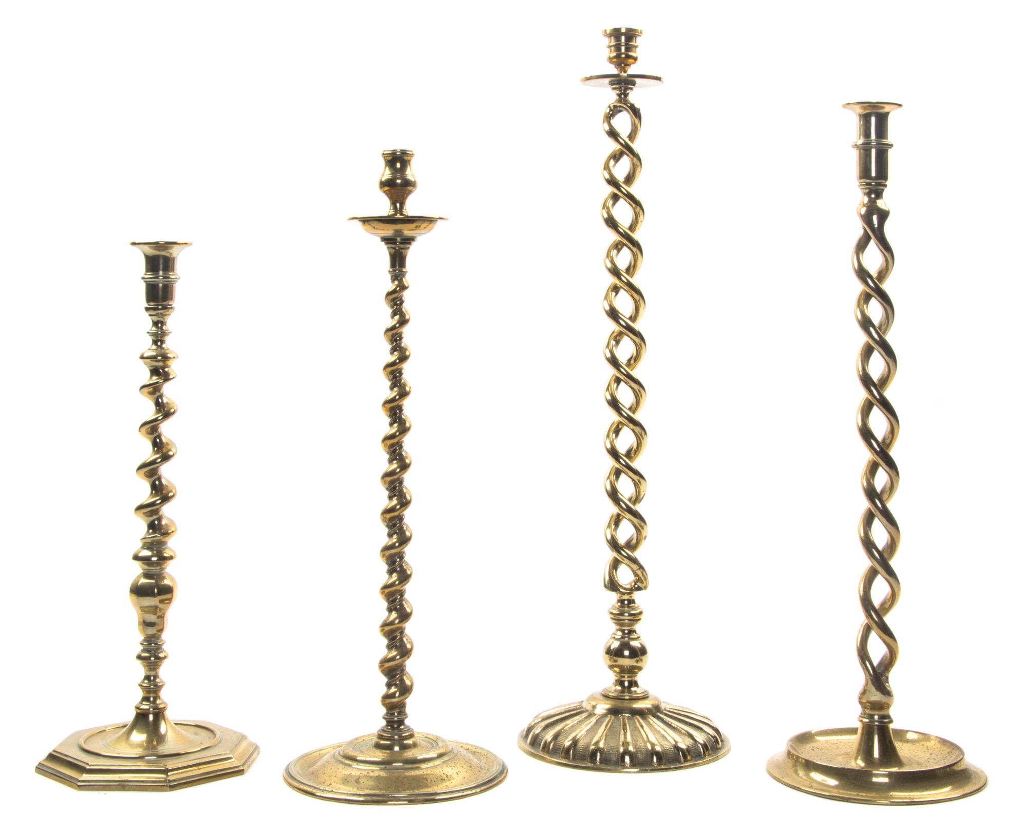 Four English Brass Barley Twist Candlesticks, Height of tallest 22 1/2 inches.