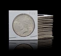 A Group of Thirteen Peace Dollars — Various Dates