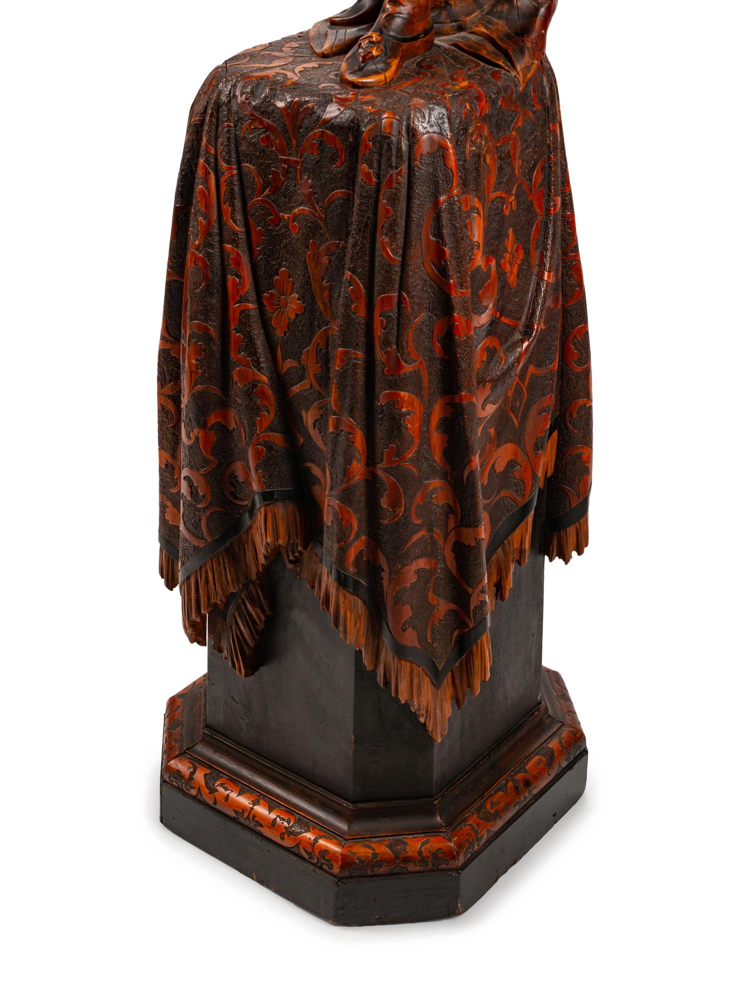 An Austrian Carved and Stained Wood Figural Torchère — LATE 19TH CENTURY