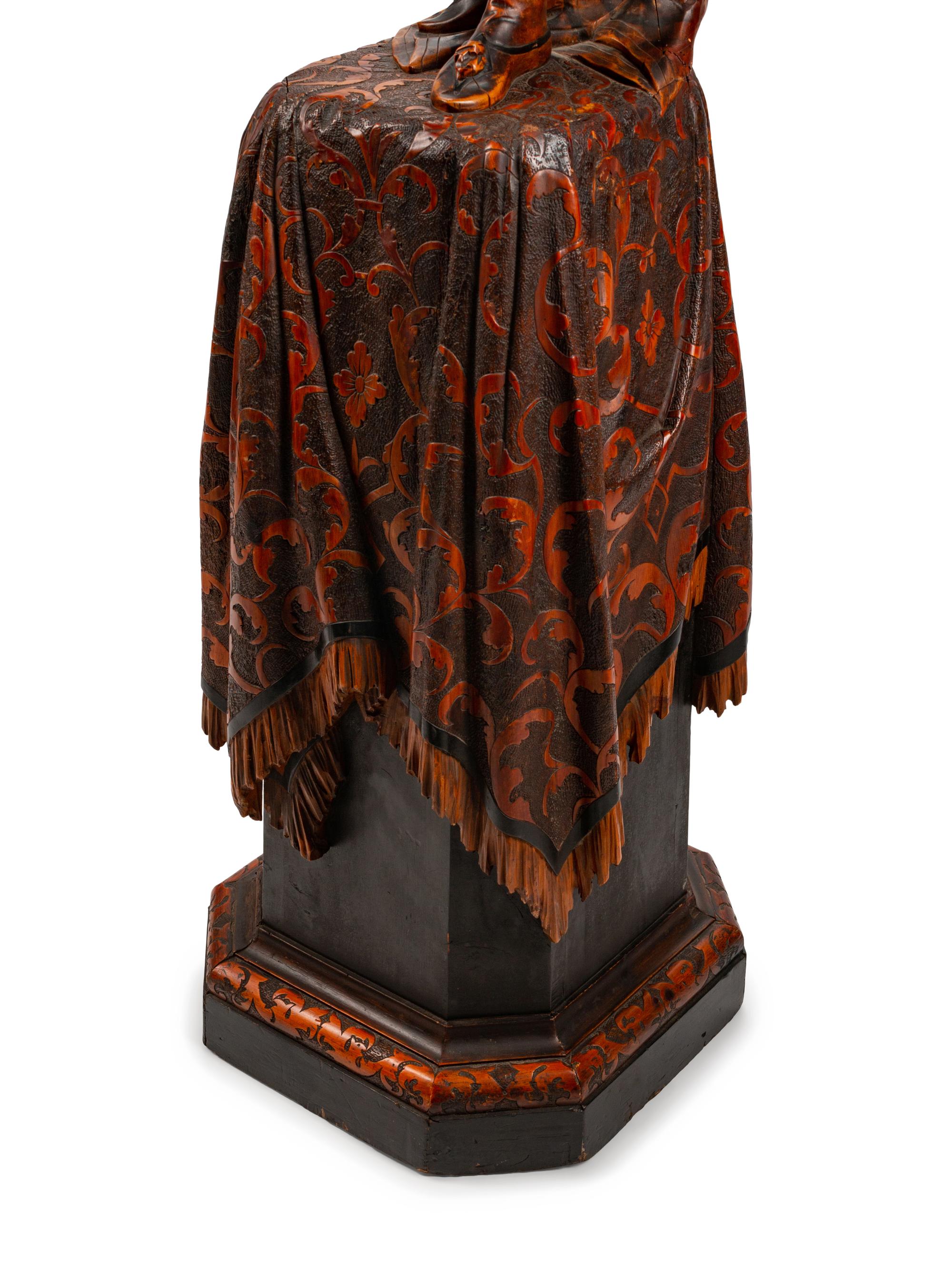 An Austrian Carved and Stained Wood Figural Torchère — LATE 19TH CENTURY