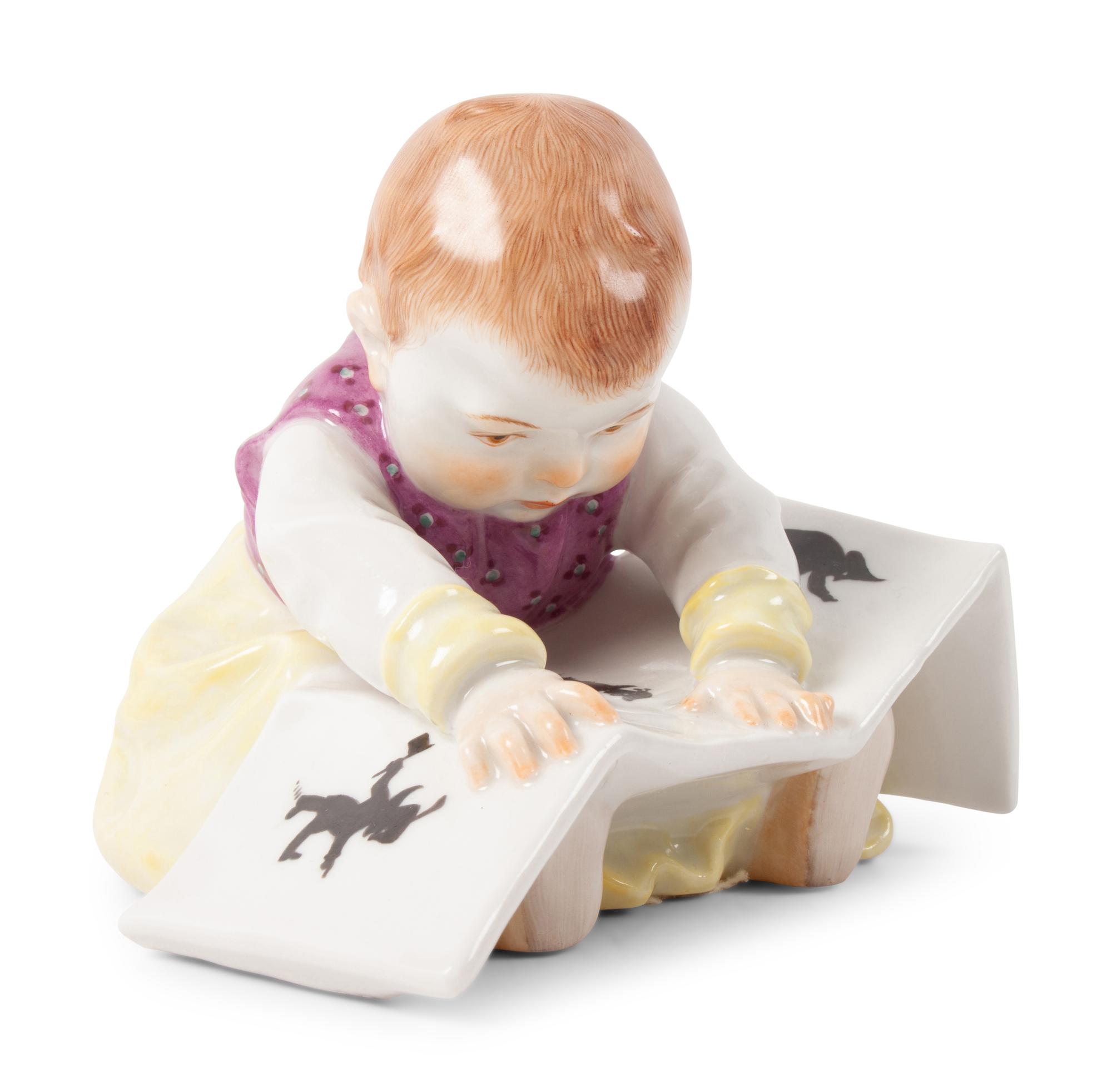 A Meissen Porcelain Baby Reading a Book, by Konrad Hentschel