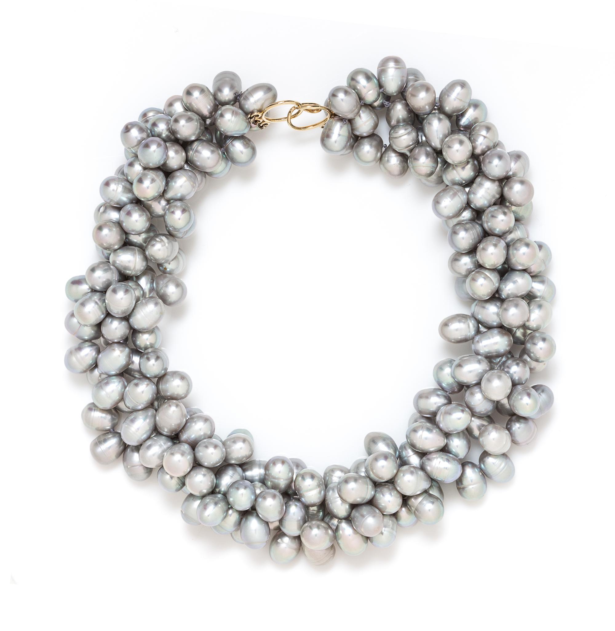 A 14 Karat Yellow Gold and Multistrand Cultured Pearl Torsade Necklace, 150.20 dwts.