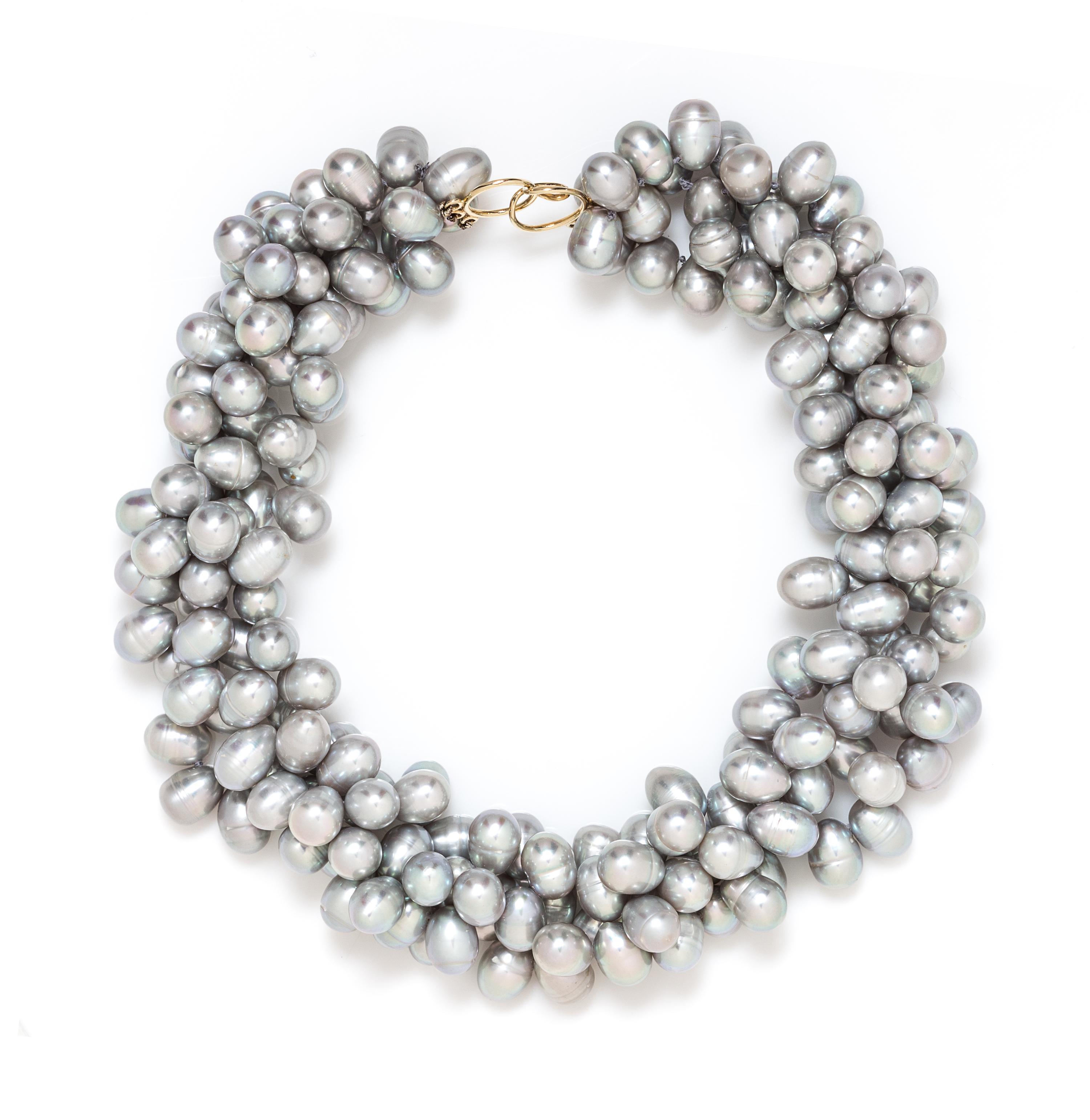 A 14 Karat Yellow Gold and Multistrand Cultured Pearl Torsade Necklace, 150.20 dwts.
